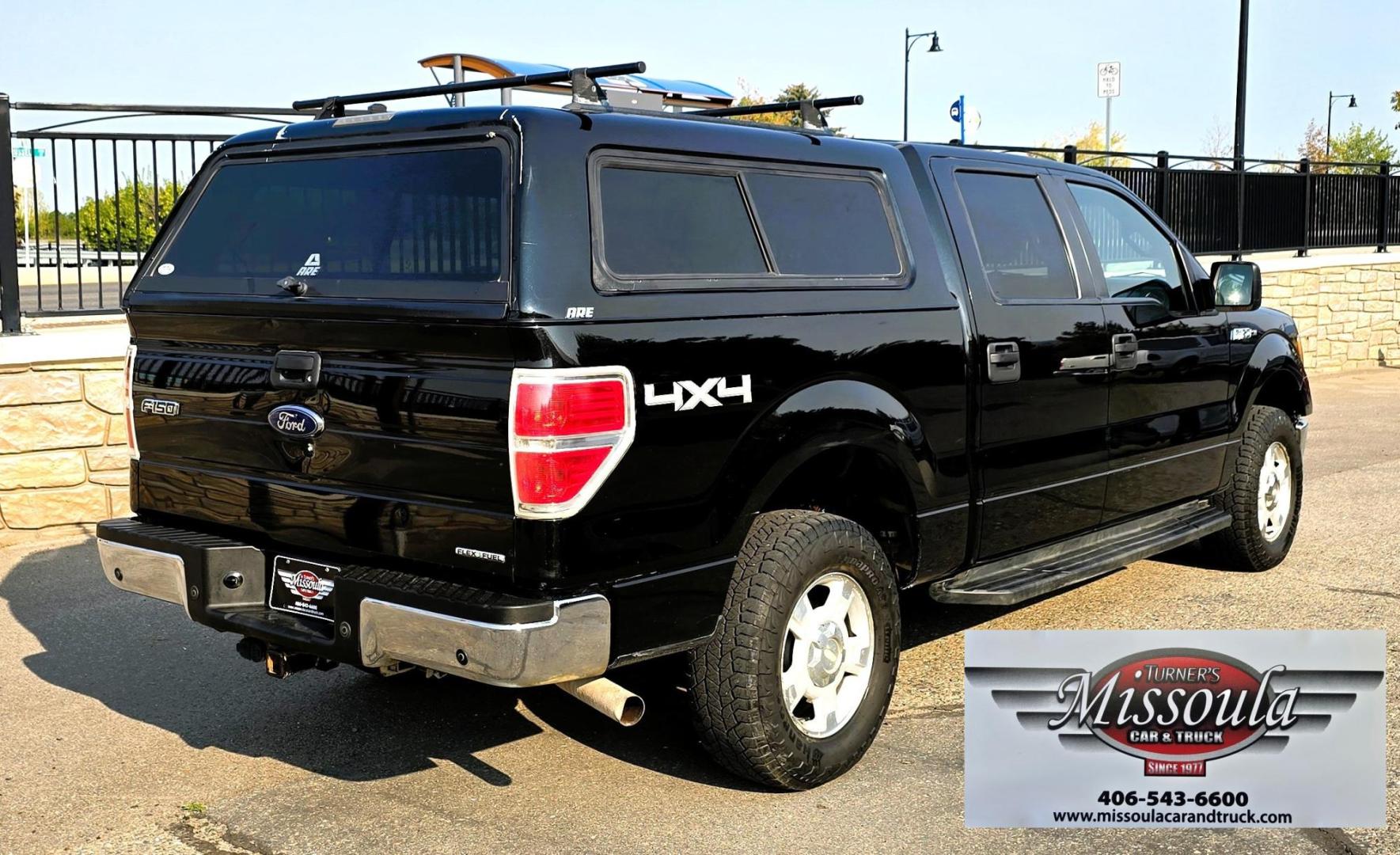 2013 Black /Gray Ford F-150 XLT SuperCrew 4WD (1FTFW1EF6DK) with an 5.0L V8 engine, 6-Speed Automatic transmission, located at 450 N Russell, Missoula, MT, 59801, (406) 543-6600, 46.874496, -114.017433 - High Miles but you wouldn't know it by how well this girl runs. 5.0L V8 Engine. 4WD.. Nice Matching Topper with Racks on top for your canoe. Air. Cruise. Tilt. Power Windows and Locks. Bluetooth Audio and Phone. AM FM XM CD Player. Power Drivers Seat. Excellent Fuel Economy for a V8 Engine. Running - Photo#2
