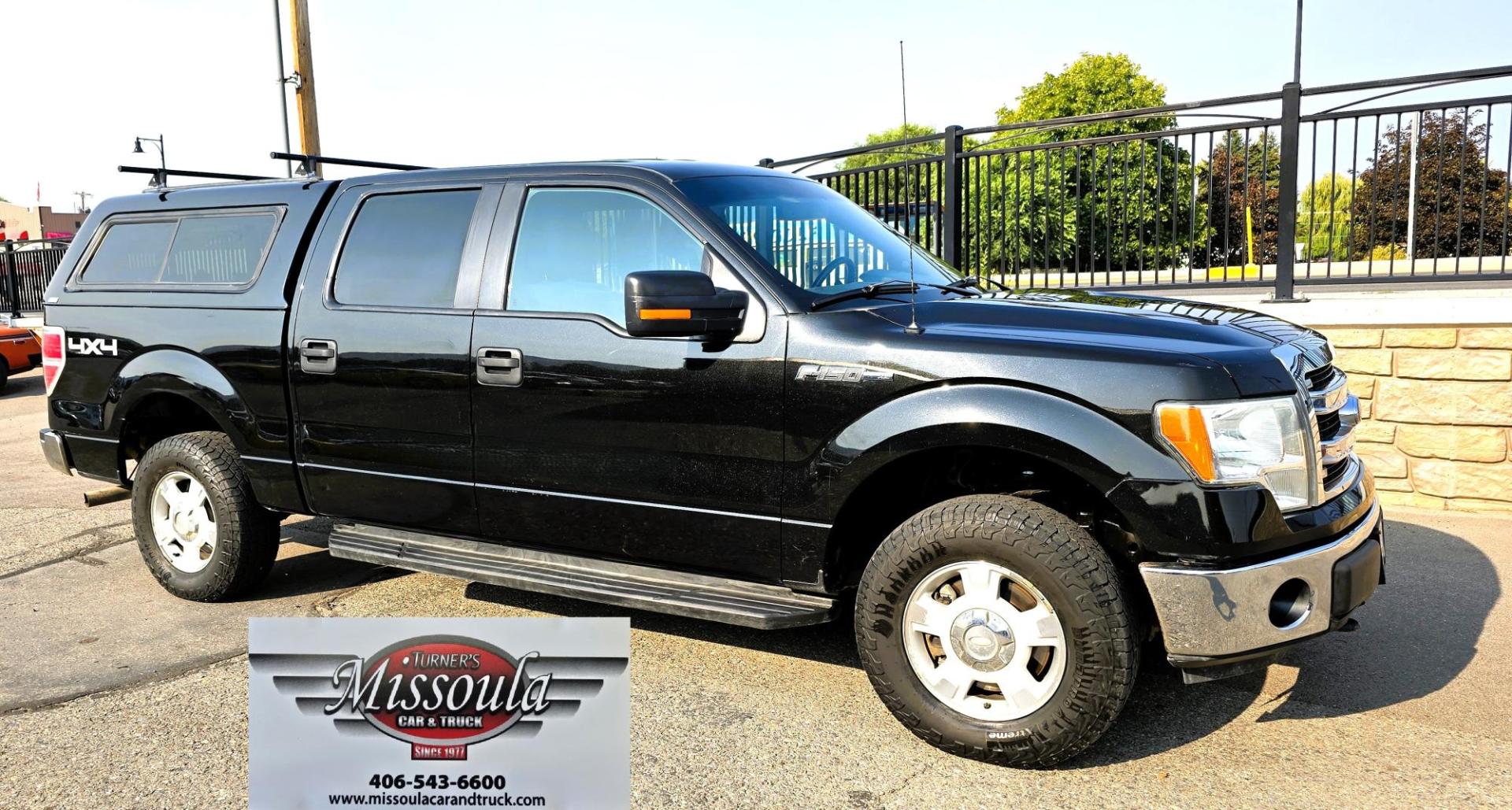 2013 Black /Gray Ford F-150 XLT SuperCrew 4WD (1FTFW1EF6DK) with an 5.0L V8 engine, 6-Speed Automatic transmission, located at 450 N Russell, Missoula, MT, 59801, (406) 543-6600, 46.874496, -114.017433 - High Miles but you wouldn't know it by how well this girl runs. 5.0L V8 Engine. 4WD.. Nice Matching Topper with Racks on top for your canoe. Air. Cruise. Tilt. Power Windows and Locks. Bluetooth Audio and Phone. AM FM XM CD Player. Power Drivers Seat. Excellent Fuel Economy for a V8 Engine. Running - Photo#5