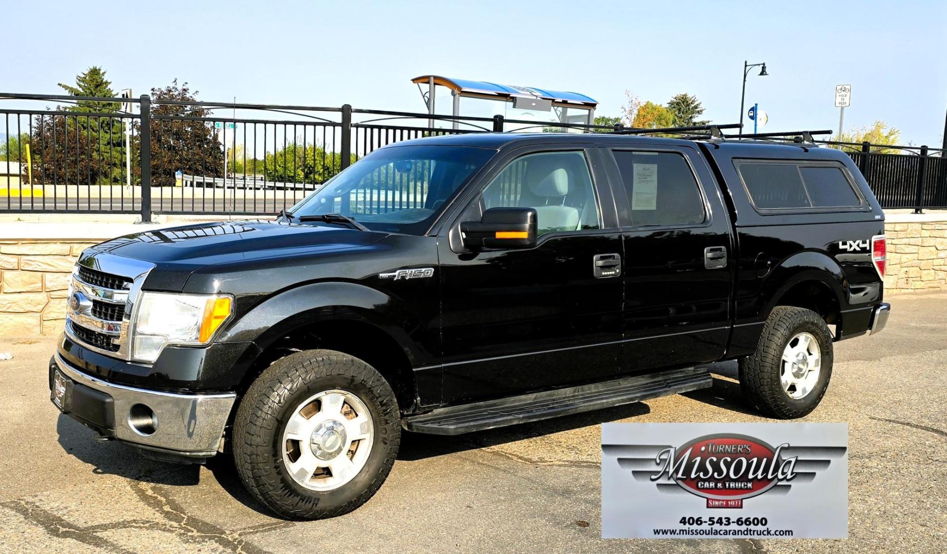2013 Black /Gray Ford F-150 XLT SuperCrew 4WD (1FTFW1EF6DK) with an 5.0L V8 engine, 6-Speed Automatic transmission, located at 450 N Russell, Missoula, MT, 59801, (406) 543-6600, 46.874496, -114.017433 - High Miles but you wouldn't know it by how well this girl runs. 5.0L V8 Engine. 4WD.. Nice Matching Topper with Racks on top for your canoe. Air. Cruise. Tilt. Power Windows and Locks. Bluetooth Audio and Phone. AM FM XM CD Player. Power Drivers Seat. Excellent Fuel Economy for a V8 Engine. Running - Photo#7