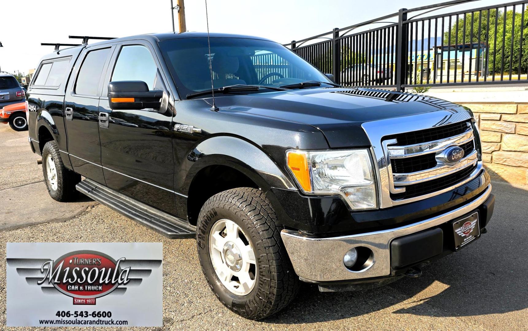 2013 Black /Gray Ford F-150 XLT SuperCrew 4WD (1FTFW1EF6DK) with an 5.0L V8 engine, 6-Speed Automatic transmission, located at 450 N Russell, Missoula, MT, 59801, (406) 543-6600, 46.874496, -114.017433 - High Miles but you wouldn't know it by how well this girl runs. 5.0L V8 Engine. 4WD.. Nice Matching Topper with Racks on top for your canoe. Air. Cruise. Tilt. Power Windows and Locks. Bluetooth Audio and Phone. AM FM XM CD Player. Power Drivers Seat. Excellent Fuel Economy for a V8 Engine. Running - Photo#6