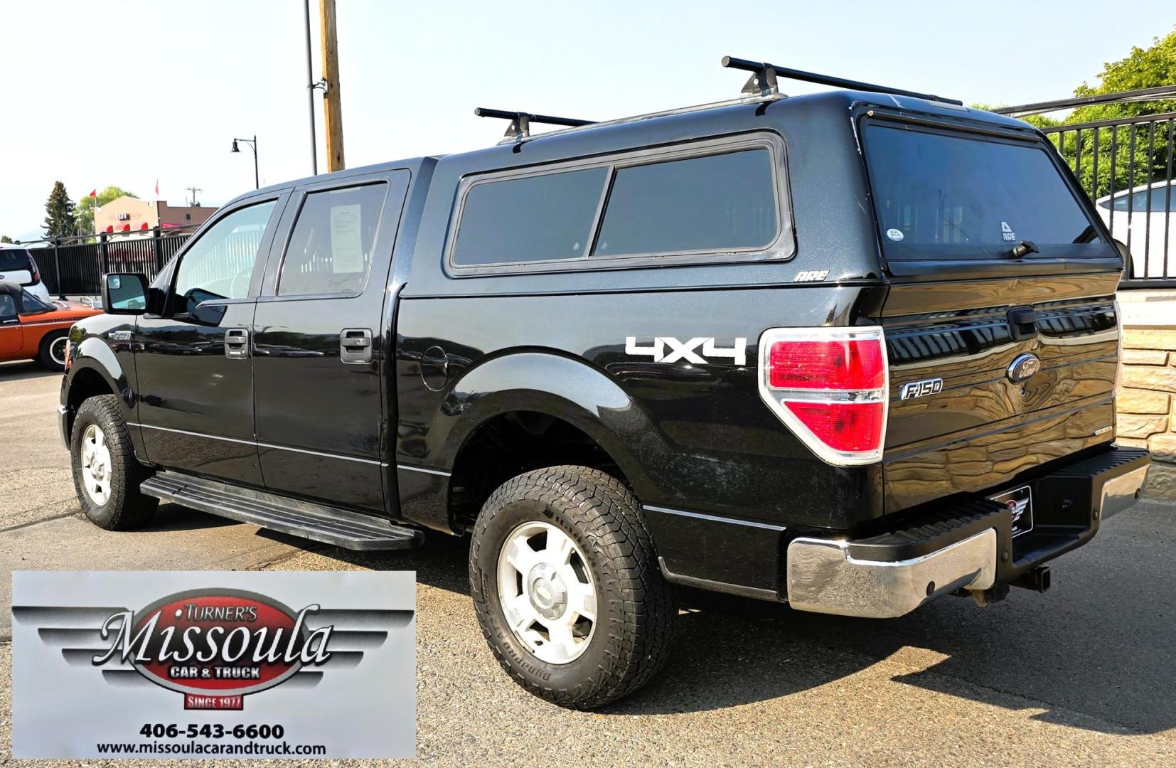 2013 Black /Gray Ford F-150 XLT SuperCrew 4WD (1FTFW1EF6DK) with an 5.0L V8 engine, 6-Speed Automatic transmission, located at 450 N Russell, Missoula, MT, 59801, (406) 543-6600, 46.874496, -114.017433 - High Miles but you wouldn't know it by how well this girl runs. 5.0L V8 Engine. 4WD.. Nice Matching Topper with Racks on top for your canoe. Air. Cruise. Tilt. Power Windows and Locks. Bluetooth Audio and Phone. AM FM XM CD Player. Power Drivers Seat. Excellent Fuel Economy for a V8 Engine. Running - Photo#9