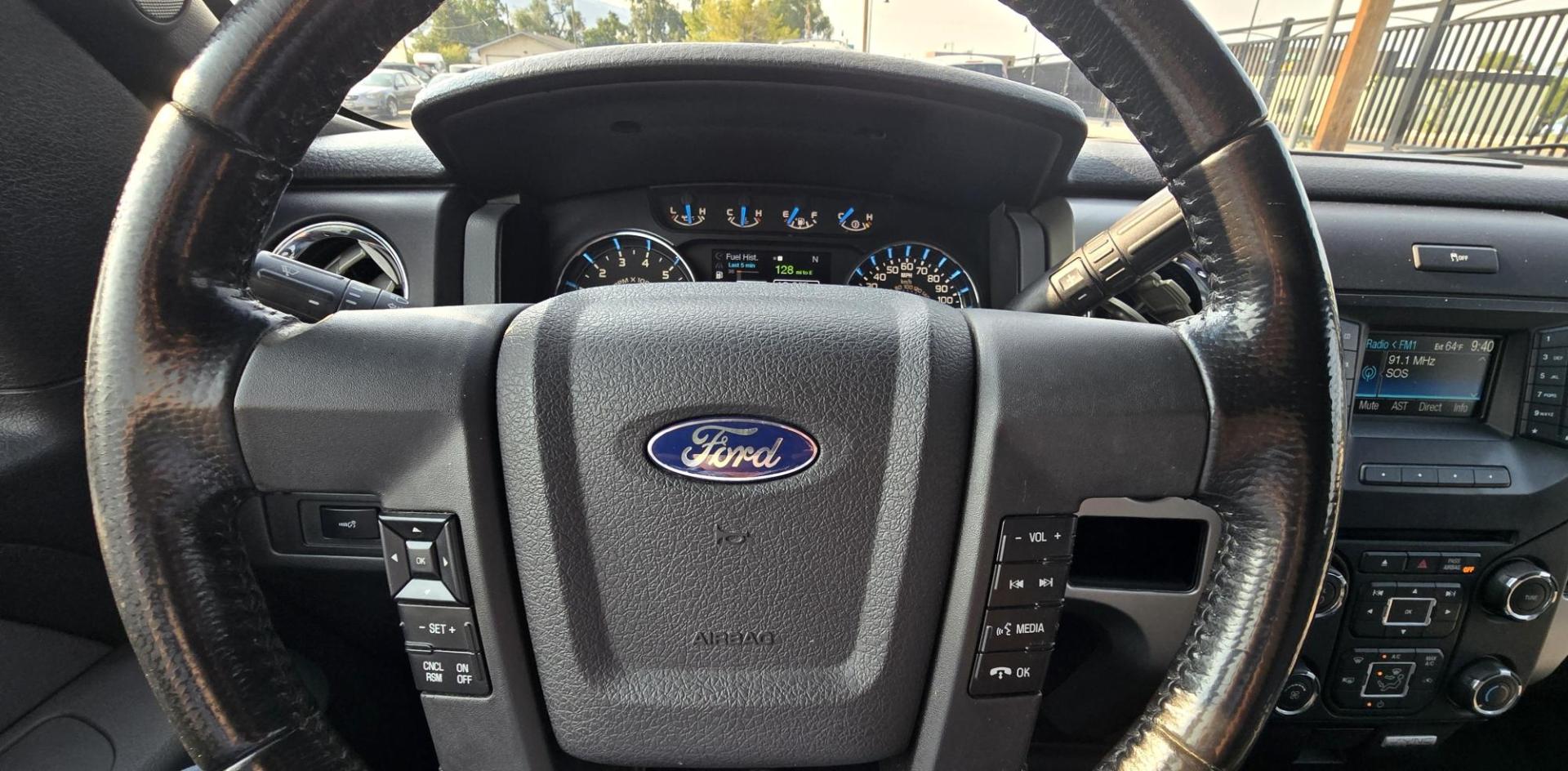 2013 Black /Gray Ford F-150 XLT SuperCrew 4WD (1FTFW1EF6DK) with an 5.0L V8 engine, 6-Speed Automatic transmission, located at 450 N Russell, Missoula, MT, 59801, (406) 543-6600, 46.874496, -114.017433 - High Miles but you wouldn't know it by how well this girl runs. 5.0L V8 Engine. 4WD.. Nice Matching Topper with Racks on top for your canoe. Air. Cruise. Tilt. Power Windows and Locks. Bluetooth Audio and Phone. AM FM XM CD Player. Power Drivers Seat. Excellent Fuel Economy for a V8 Engine. Running - Photo#18