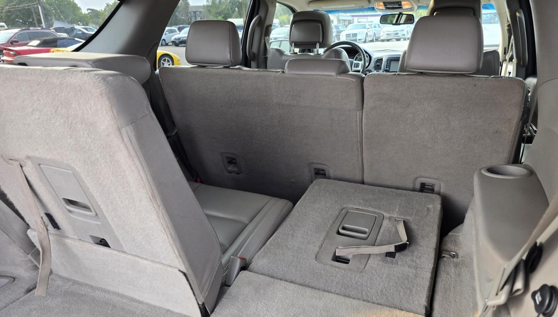 2013 White /Black Dodge Durango Crew AWD (1C4SDJDT7DC) with an 5.7L V8 OHV 16V engine, 5-Speed Automatic transmission, located at 450 N Russell, Missoula, MT, 59801, (406) 543-6600, 46.874496, -114.017433 - 5.7 Hemi Powered AWD SUV. 3rd Row Seating. Power Sunroof. Remote Start. Heated Leather Front Seats. AM FM SAT CD Player. Navigation. Bluetooth Audio and Phone. Backup Camera. Air. Cruise. Tilt. Lots of Power to Play and the Room of a Family Car. - Photo#9