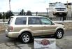 2006 Gold /Tan Honda Pilot EX 4WD w/Leather and Navigation (2HKYF18726H) with an 3.5L V6 SOHC 24V engine, 5-Speed Automatic Overdrive transmission, located at 450 N Russell, Missoula, MT, 59801, (406) 543-6600, 46.874496, -114.017433 - One Owner Honda Pilot AWD. 3.5L V6 Engine. Leather Heated Front Seats. 3rd Row Seating. Power Sun Roof. Power Windows and Locks. Air. Cruise. Tilt. Navigation. Bluetooth. Backup Camera. AM FM XM CD Changer. Timing Belt was Replaced at 120K We Finance through local Credit Unions. We do NOT off - Photo#1