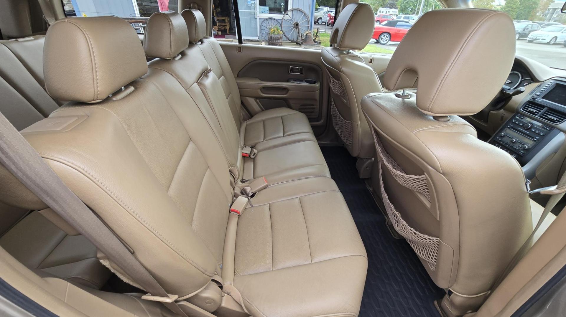 2006 Gold /Tan Honda Pilot EX 4WD w/Leather and Navigation (2HKYF18726H) with an 3.5L V6 SOHC 24V engine, 5-Speed Automatic Overdrive transmission, located at 450 N Russell, Missoula, MT, 59801, (406) 543-6600, 46.874496, -114.017433 - One Owner Honda Pilot AWD. 3.5L V6 Engine. Leather Heated Front Seats. 3rd Row Seating. Power Sun Roof. Power Windows and Locks. Air. Cruise. Tilt. Navigation. Bluetooth. Backup Camera. AM FM XM CD Changer. Timing Belt was Replaced at 120K We Finance through local Credit Unions. We do NOT off - Photo#13