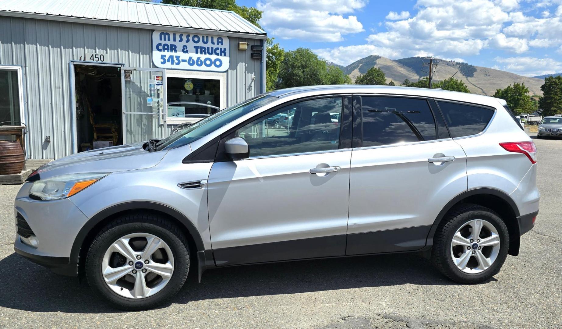 2014 Silver /Gray Ford Escape SE 4WD (1FMCU9G93EU) with an 2.0L L4 DOHC 16V engine, 6-Speed Automatic transmission, located at 450 N Russell, Missoula, MT, 59801, (406) 543-6600, 46.874496, -114.017433 - Affordable AWD SUV. Economical 2.0L I4 Engine. 6 Speed Automatic Transmission. Air. Cruise. Tilt. Power Windows and Locks. AM FM CD Player. Bluetooth Audio and Phone. Backup Camera. Towing. We Finance through local Credit Unions. We do NOT offer In House (Buy Here Pay Here) Financing. - Photo#4