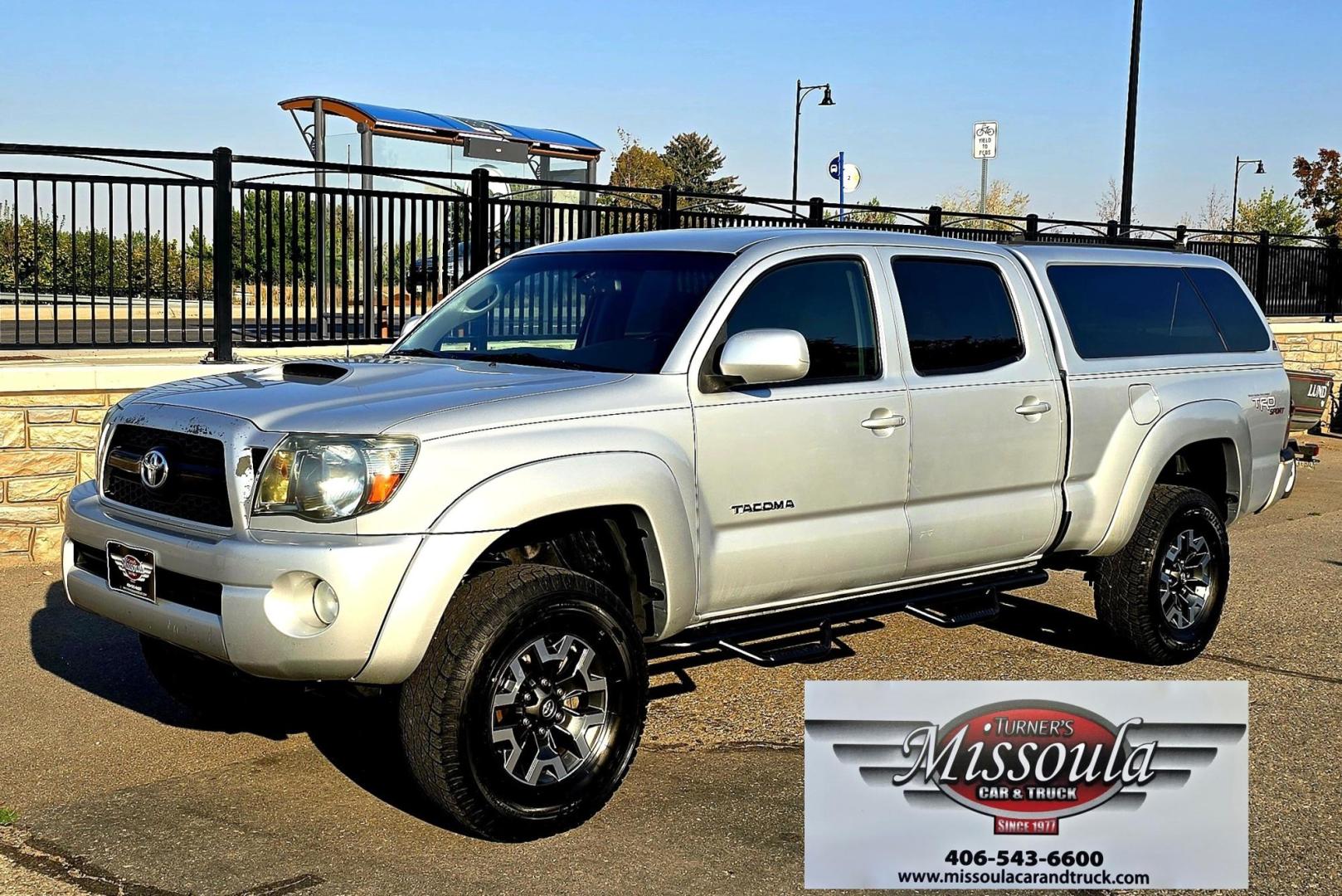 2011 Silver /Gray Toyota Tacoma Double Cab Long Bed V6 Auto 4WD (3TMMU4FN7BM) with an 4.0L V6 DOHC 24V engine, 5-Speed Automatic transmission, located at 450 N Russell, Missoula, MT, 59801, (406) 543-6600, 46.874496, -114.017433 - Hard to Find Tacoma 4WD with Matching Leer Topper. 4.0L V6 Engine. Automatic Transmission. Air. Cruise. Tilt. Power Windows and Locks. AM FM CD Player with Bluetooth Audio and Phone. Comes with two sets of Tires and Wheels. The second set is studded snow tires. Running Boards. Towing. Yes, it has a - Photo#4