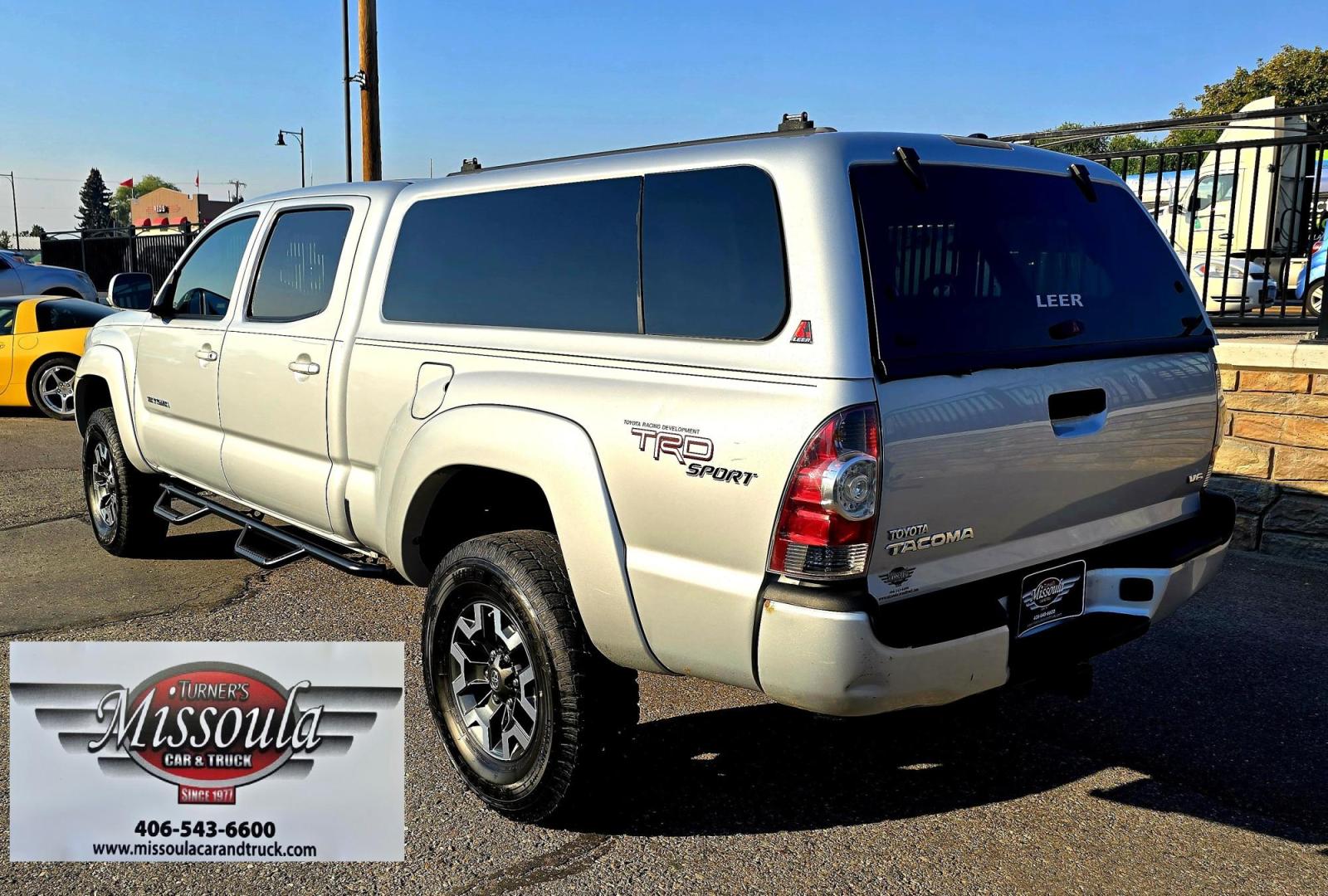 2011 Silver /Gray Toyota Tacoma Double Cab Long Bed V6 Auto 4WD (3TMMU4FN7BM) with an 4.0L V6 DOHC 24V engine, 5-Speed Automatic transmission, located at 450 N Russell, Missoula, MT, 59801, (406) 543-6600, 46.874496, -114.017433 - Hard to Find Tacoma 4WD with Matching Leer Topper. 4.0L V6 Engine. Automatic Transmission. Air. Cruise. Tilt. Power Windows and Locks. AM FM CD Player with Bluetooth Audio and Phone. Comes with two sets of Tires and Wheels. The second set is studded snow tires. Running Boards. Towing. Yes, it has a - Photo#7
