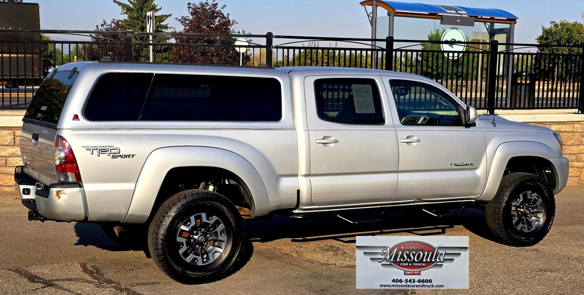 2011 Silver /Gray Toyota Tacoma Double Cab Long Bed V6 Auto 4WD (3TMMU4FN7BM) with an 4.0L V6 DOHC 24V engine, 5-Speed Automatic transmission, located at 450 N Russell, Missoula, MT, 59801, (406) 543-6600, 46.874496, -114.017433 - Hard to Find Tacoma 4WD with Matching Leer Topper. 4.0L V6 Engine. Automatic Transmission. Air. Cruise. Tilt. Power Windows and Locks. AM FM CD Player with Bluetooth Audio and Phone. Comes with two sets of Tires and Wheels. The second set is studded snow tires. Running Boards. Towing. Yes, it has a - Photo#3