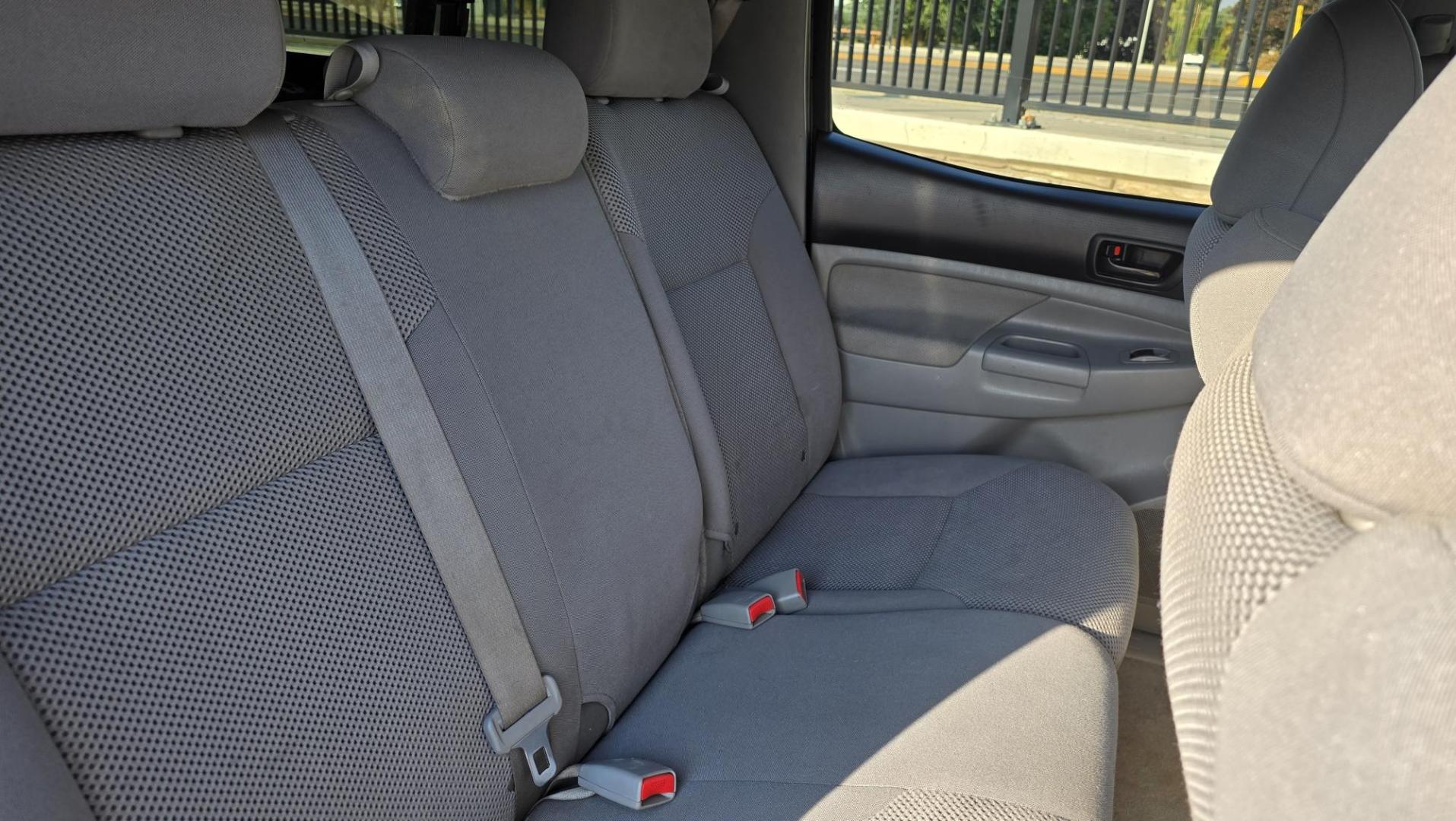 2011 Silver /Gray Toyota Tacoma Double Cab Long Bed V6 Auto 4WD (3TMMU4FN7BM) with an 4.0L V6 DOHC 24V engine, 5-Speed Automatic transmission, located at 450 N Russell, Missoula, MT, 59801, (406) 543-6600, 46.874496, -114.017433 - Hard to Find Tacoma 4WD with Matching Leer Topper. 4.0L V6 Engine. Automatic Transmission. Air. Cruise. Tilt. Power Windows and Locks. AM FM CD Player with Bluetooth Audio and Phone. Comes with two sets of Tires and Wheels. The second set is studded snow tires. Running Boards. Towing. Yes, it has a - Photo#13