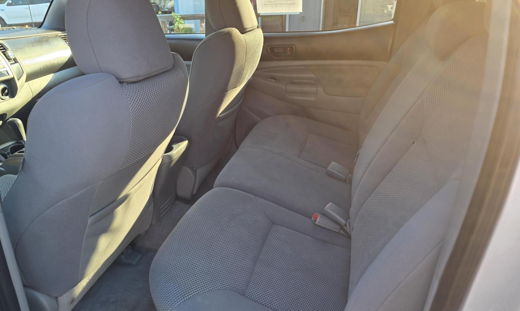 2011 Silver /Gray Toyota Tacoma Double Cab Long Bed V6 Auto 4WD (3TMMU4FN7BM) with an 4.0L V6 DOHC 24V engine, 5-Speed Automatic transmission, located at 450 N Russell, Missoula, MT, 59801, (406) 543-6600, 46.874496, -114.017433 - Hard to Find Tacoma 4WD with Matching Leer Topper. 4.0L V6 Engine. Automatic Transmission. Air. Cruise. Tilt. Power Windows and Locks. AM FM CD Player with Bluetooth Audio and Phone. Comes with two sets of Tires and Wheels. The second set is studded snow tires. Running Boards. Towing. Yes, it has a - Photo#16