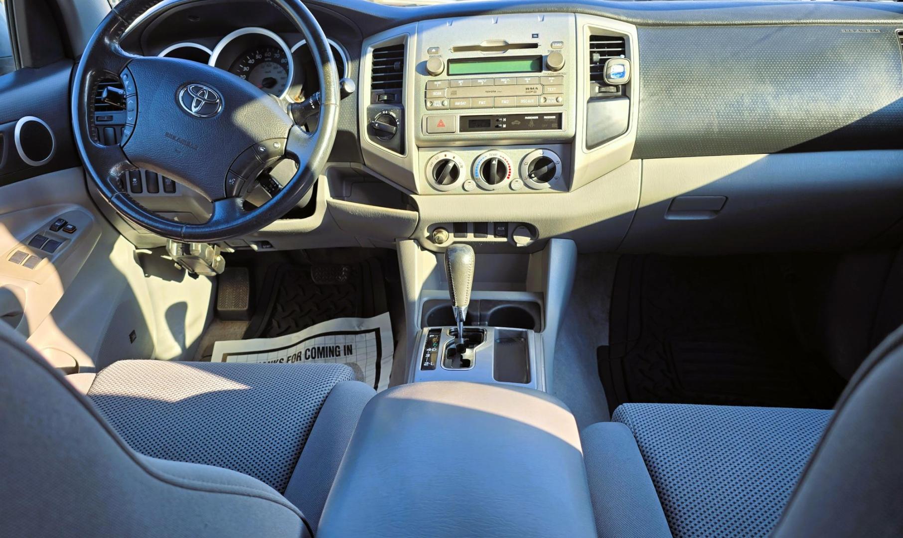 2011 Silver /Gray Toyota Tacoma Double Cab Long Bed V6 Auto 4WD (3TMMU4FN7BM) with an 4.0L V6 DOHC 24V engine, 5-Speed Automatic transmission, located at 450 N Russell, Missoula, MT, 59801, (406) 543-6600, 46.874496, -114.017433 - Hard to Find Tacoma 4WD with Matching Leer Topper. 4.0L V6 Engine. Automatic Transmission. Air. Cruise. Tilt. Power Windows and Locks. AM FM CD Player with Bluetooth Audio and Phone. Comes with two sets of Tires and Wheels. The second set is studded snow tires. Running Boards. Towing. Yes, it has a - Photo#15