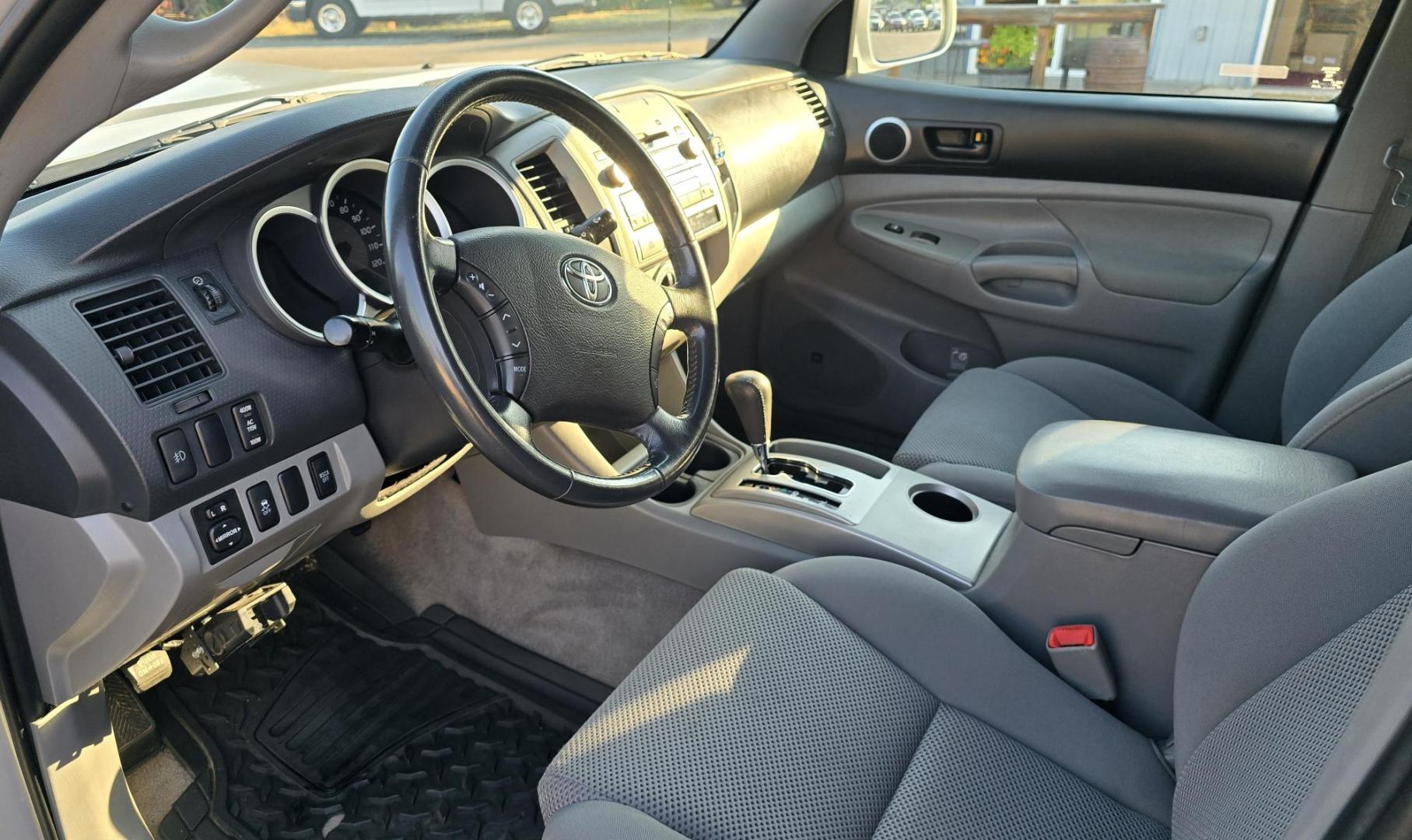 2011 Silver /Gray Toyota Tacoma Double Cab Long Bed V6 Auto 4WD (3TMMU4FN7BM) with an 4.0L V6 DOHC 24V engine, 5-Speed Automatic transmission, located at 450 N Russell, Missoula, MT, 59801, (406) 543-6600, 46.874496, -114.017433 - Hard to Find Tacoma 4WD with Matching Leer Topper. 4.0L V6 Engine. Automatic Transmission. Air. Cruise. Tilt. Power Windows and Locks. AM FM CD Player with Bluetooth Audio and Phone. Comes with two sets of Tires and Wheels. The second set is studded snow tires. Running Boards. Towing. Yes, it has a - Photo#17