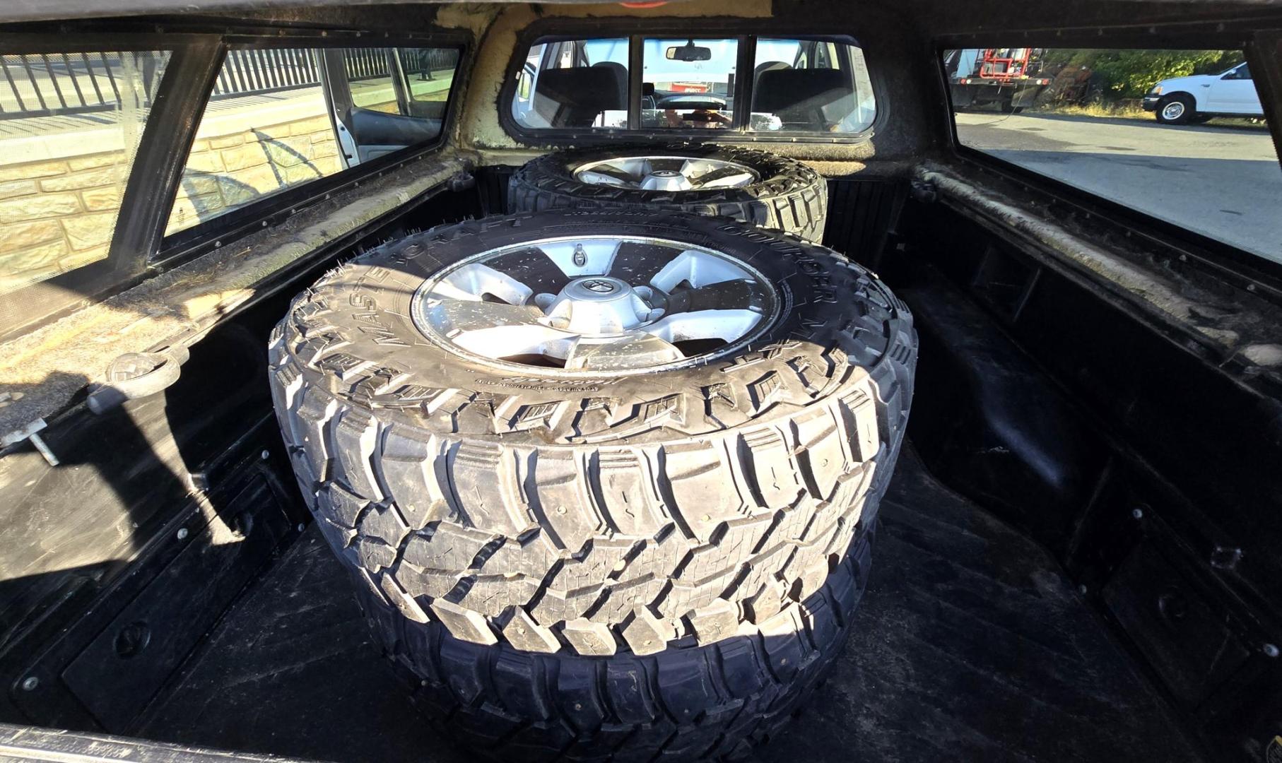 2011 Silver /Gray Toyota Tacoma Double Cab Long Bed V6 Auto 4WD (3TMMU4FN7BM) with an 4.0L V6 DOHC 24V engine, 5-Speed Automatic transmission, located at 450 N Russell, Missoula, MT, 59801, (406) 543-6600, 46.874496, -114.017433 - Hard to Find Tacoma 4WD with Matching Leer Topper. 4.0L V6 Engine. Automatic Transmission. Air. Cruise. Tilt. Power Windows and Locks. AM FM CD Player with Bluetooth Audio and Phone. Comes with two sets of Tires and Wheels. The second set is studded snow tires. Running Boards. Towing. Yes, it has a - Photo#22