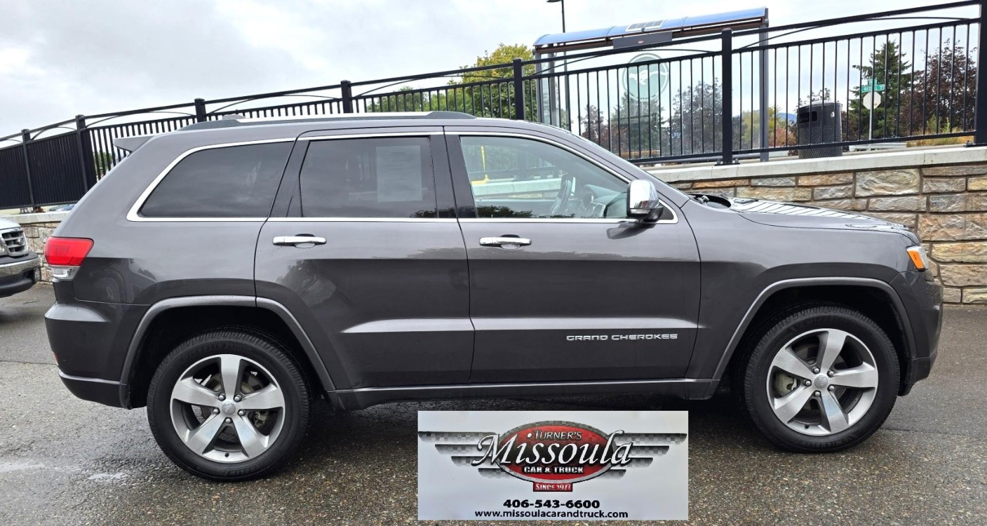 2015 Grey /Black Jeep Grand Cherokee Overland 4WD (1C4RJFCGXFC) with an 3.6L V6 DOHC 24V engine, 8-Speed Automatic transmission, located at 450 N Russell, Missoula, MT, 59801, (406) 543-6600, 46.874496, -114.017433 - Clean 4WD SUV. Peppy 3.6L V6 Engine. 8 Speed Automatic Transmission this Paddle Shifters for Manual Shifting. Huge Panoramic Sun Roof. Front and Rear Heated Seats. Heated Steering Wheel. Vented Front Seats for Cooling. AM FM SAT. Bluetooth Audio and Phone. Navigation. Backup Camera. Remote Start. Po - Photo#1