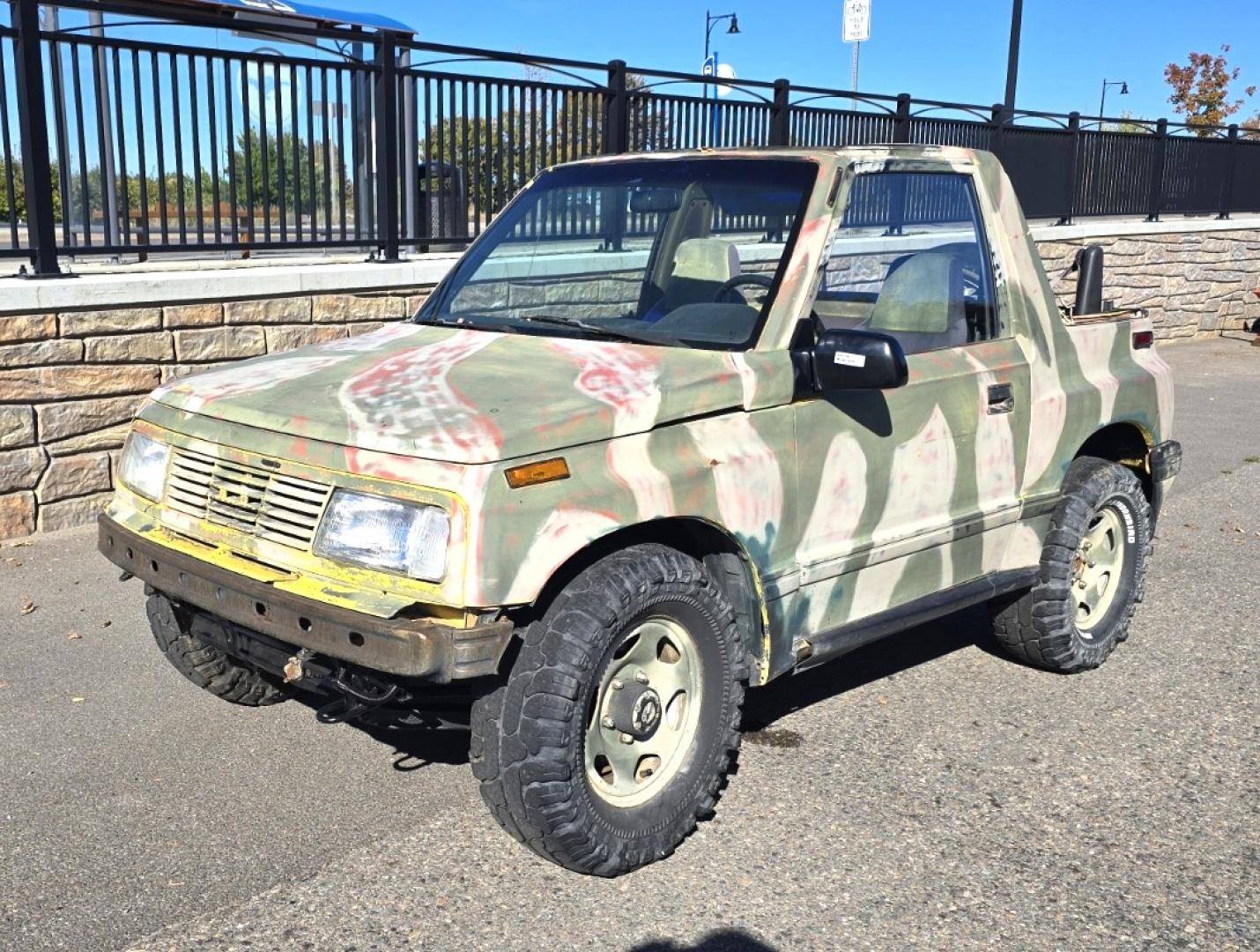 1993 Camo Geo Tracker 2-Door 4WD (2CNBJ18U7P6) with an 1.6L L4 SOHC 8V engine, 4 Speed Manual transmission, located at 450 N Russell, Missoula, MT, 59801, (406) 543-6600, 46.874496, -114.017433 - One Owner with only 34K Miles. Not the prettiest but runs amazing. Owner bought it to keep at his cabin it it has very little use. Somewhere along the way he lost the top to it. 1.6L I4 Engine. 4 Speed Manual Transmission. 4WD. Seats Five. More comfortable than an ATV with similar attributes. B - Photo#1