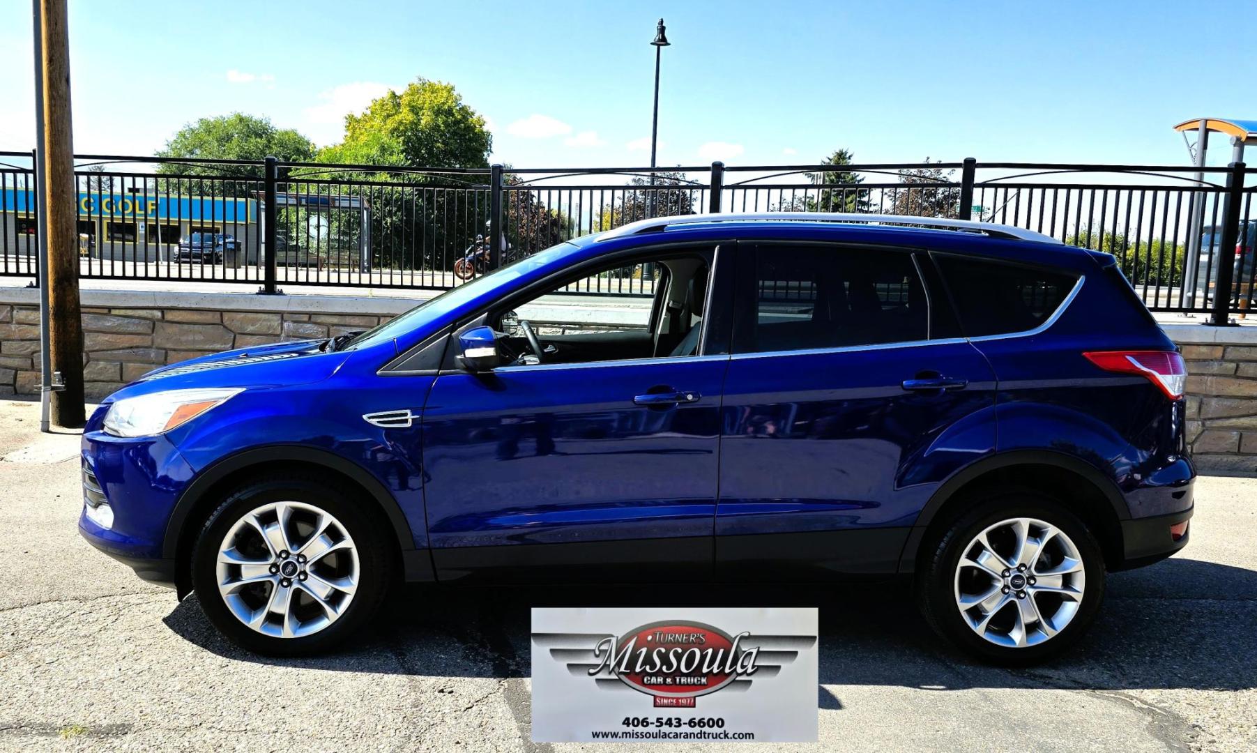 2014 Blue /Black Ford Escape Titanium 4WD (1FMCU9J98EU) with an 2.0L L4 DOHC 16V engine, 6-Speed Automatic transmission, located at 450 N Russell, Missoula, MT, 59801, (406) 543-6600, 46.874496, -114.017433 - Clean One Owner AWD SUV. 2.0L I4 EcoBoost Engine. Automatic Transmission. Air. Cruise. Tilt. Power Drivers Seat. Heated Front Seats. AM FM CD Bluetooth. Microsoft Sync Technology. Touchscreen. Navigation. Power Windows and Locks. Backup Camera. Remote Start. Clean Title and Carfax. - Photo#1
