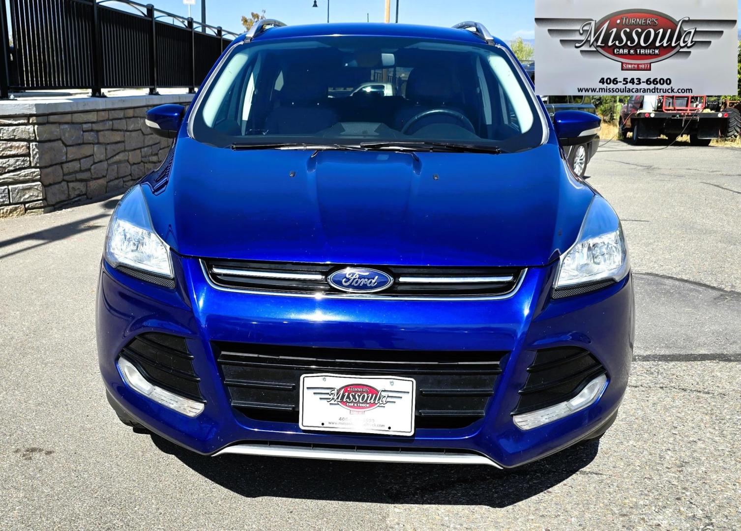 2014 Blue /Black Ford Escape Titanium 4WD (1FMCU9J98EU) with an 2.0L L4 DOHC 16V engine, 6-Speed Automatic transmission, located at 450 N Russell, Missoula, MT, 59801, (406) 543-6600, 46.874496, -114.017433 - Clean One Owner AWD SUV. 2.0L I4 EcoBoost Engine. Automatic Transmission. Air. Cruise. Tilt. Power Drivers Seat. Heated Front Seats. AM FM CD Bluetooth. Microsoft Sync Technology. Touchscreen. Navigation. Power Windows and Locks. Backup Camera. Remote Start. Clean Title and Carfax. - Photo#5