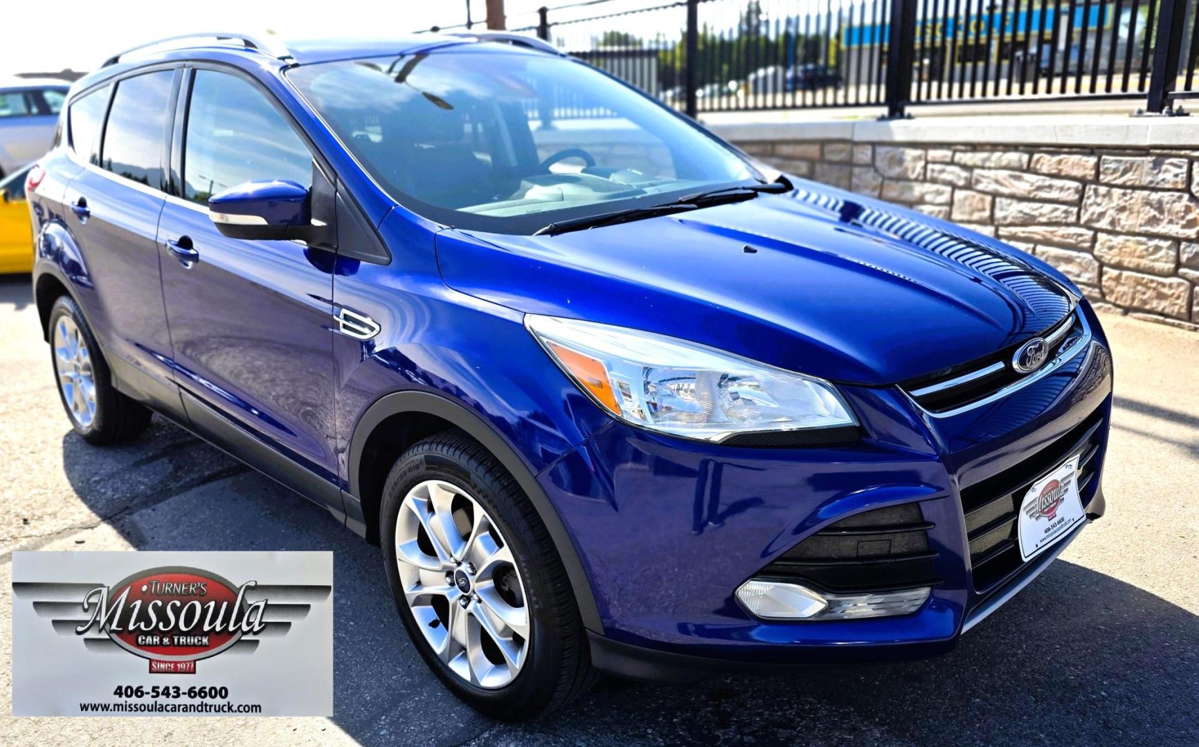 2014 Blue /Black Ford Escape Titanium 4WD (1FMCU9J98EU) with an 2.0L L4 DOHC 16V engine, 6-Speed Automatic transmission, located at 450 N Russell, Missoula, MT, 59801, (406) 543-6600, 46.874496, -114.017433 - Clean One Owner AWD SUV. 2.0L I4 EcoBoost Engine. Automatic Transmission. Air. Cruise. Tilt. Power Drivers Seat. Heated Front Seats. AM FM CD Bluetooth. Microsoft Sync Technology. Touchscreen. Navigation. Power Windows and Locks. Backup Camera. Remote Start. Clean Title and Carfax. - Photo#7