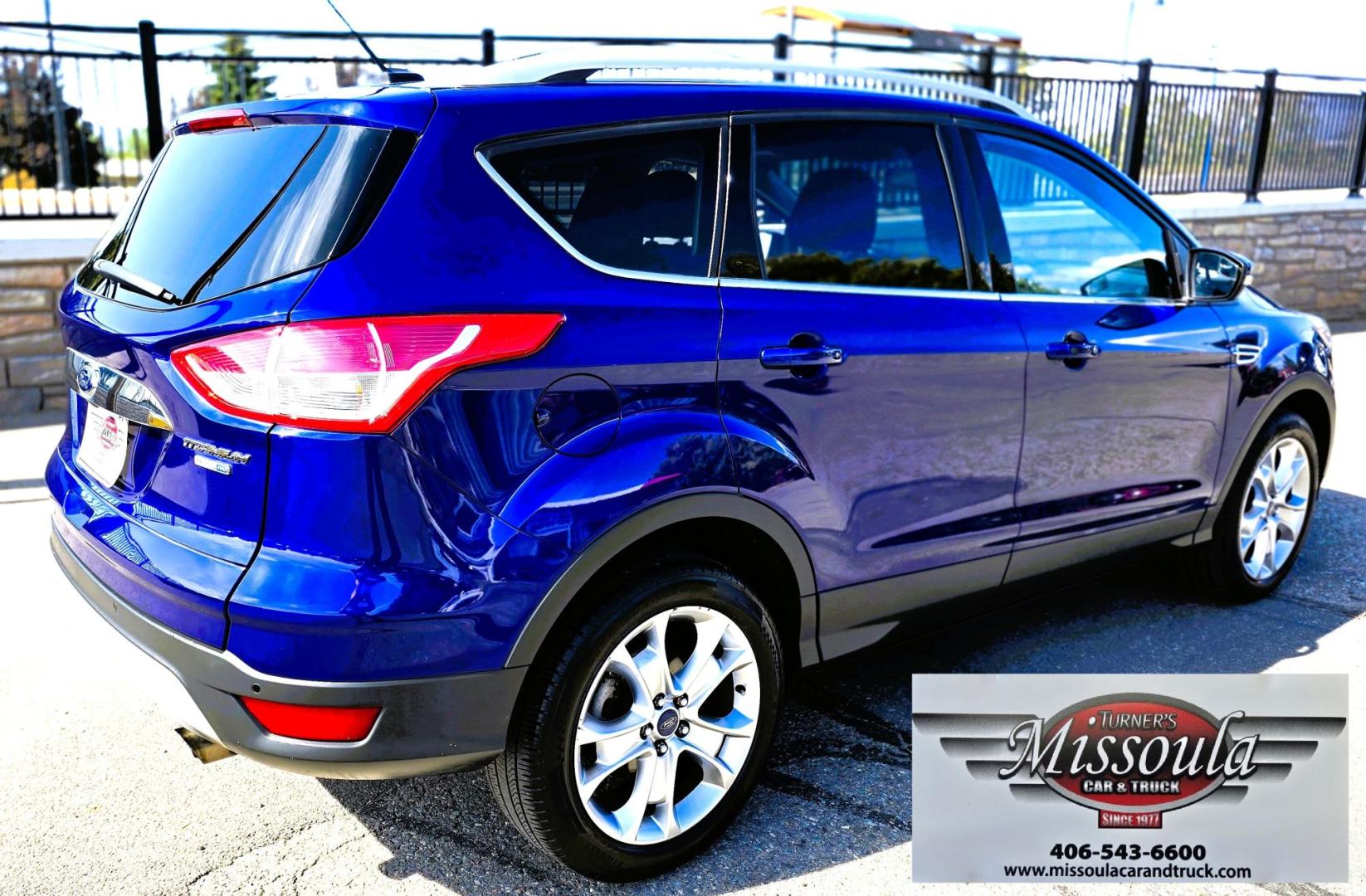 2014 Blue /Black Ford Escape Titanium 4WD (1FMCU9J98EU) with an 2.0L L4 DOHC 16V engine, 6-Speed Automatic transmission, located at 450 N Russell, Missoula, MT, 59801, (406) 543-6600, 46.874496, -114.017433 - Clean One Owner AWD SUV. 2.0L I4 EcoBoost Engine. Automatic Transmission. Air. Cruise. Tilt. Power Drivers Seat. Heated Front Seats. AM FM CD Bluetooth. Microsoft Sync Technology. Touchscreen. Navigation. Power Windows and Locks. Backup Camera. Remote Start. Clean Title and Carfax. - Photo#8