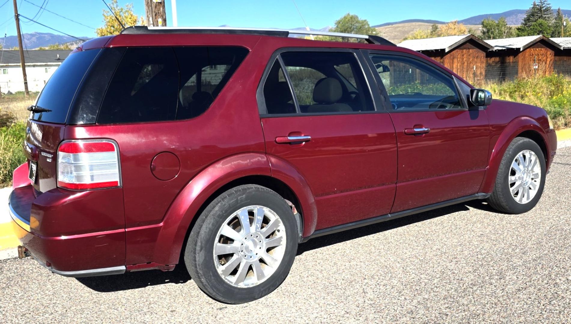 2008 Maroon /Tan Ford Taurus X Limited AWD (1FMDK06W58G) with an 3.5L V6 DOHC 24V engine, 6-Speed Automatic Overdrive transmission, located at 450 N Russell, Missoula, MT, 59801, (406) 543-6600, 46.874496, -114.017433 - AWD SUV High Miles but Runs Amazing. 3.5L V6 Engine. 3rd Row Seating. Rear Entertainment (DVD). Front and Rear Climate Controls. Air. Cruise. Tilt. Bluetooth. AM CM CD Player. Power Heated Front Seats. Hard to Find a AWD with 3rd Row for this Price in such good condition. We Finance through loca - Photo#2