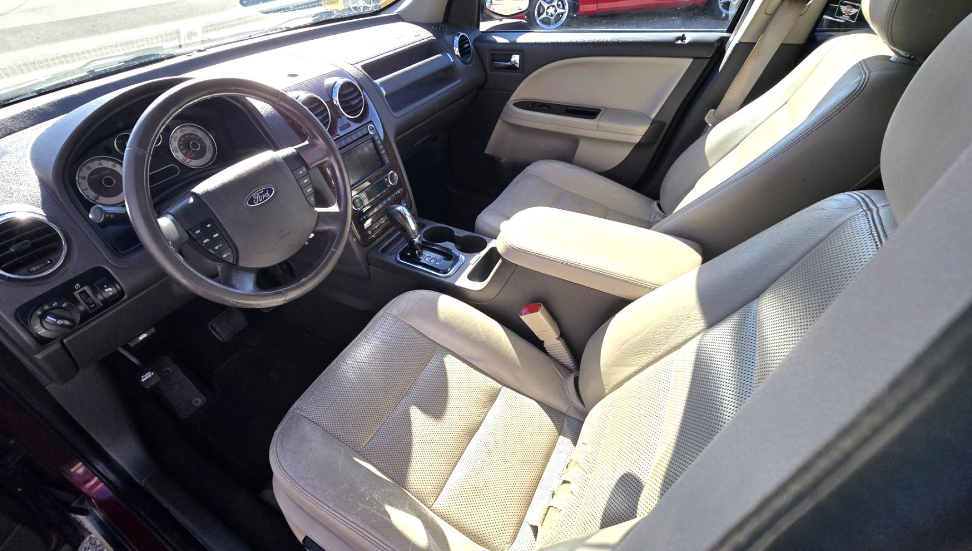 2008 Maroon /Tan Ford Taurus X Limited AWD (1FMDK06W58G) with an 3.5L V6 DOHC 24V engine, 6-Speed Automatic Overdrive transmission, located at 450 N Russell, Missoula, MT, 59801, (406) 543-6600, 46.874496, -114.017433 - AWD SUV High Miles but Runs Amazing. 3.5L V6 Engine. 3rd Row Seating. Rear Entertainment (DVD). Front and Rear Climate Controls. Air. Cruise. Tilt. Bluetooth. AM CM CD Player. Power Heated Front Seats. Hard to Find a AWD with 3rd Row for this Price in such good condition. We Finance through loca - Photo#11