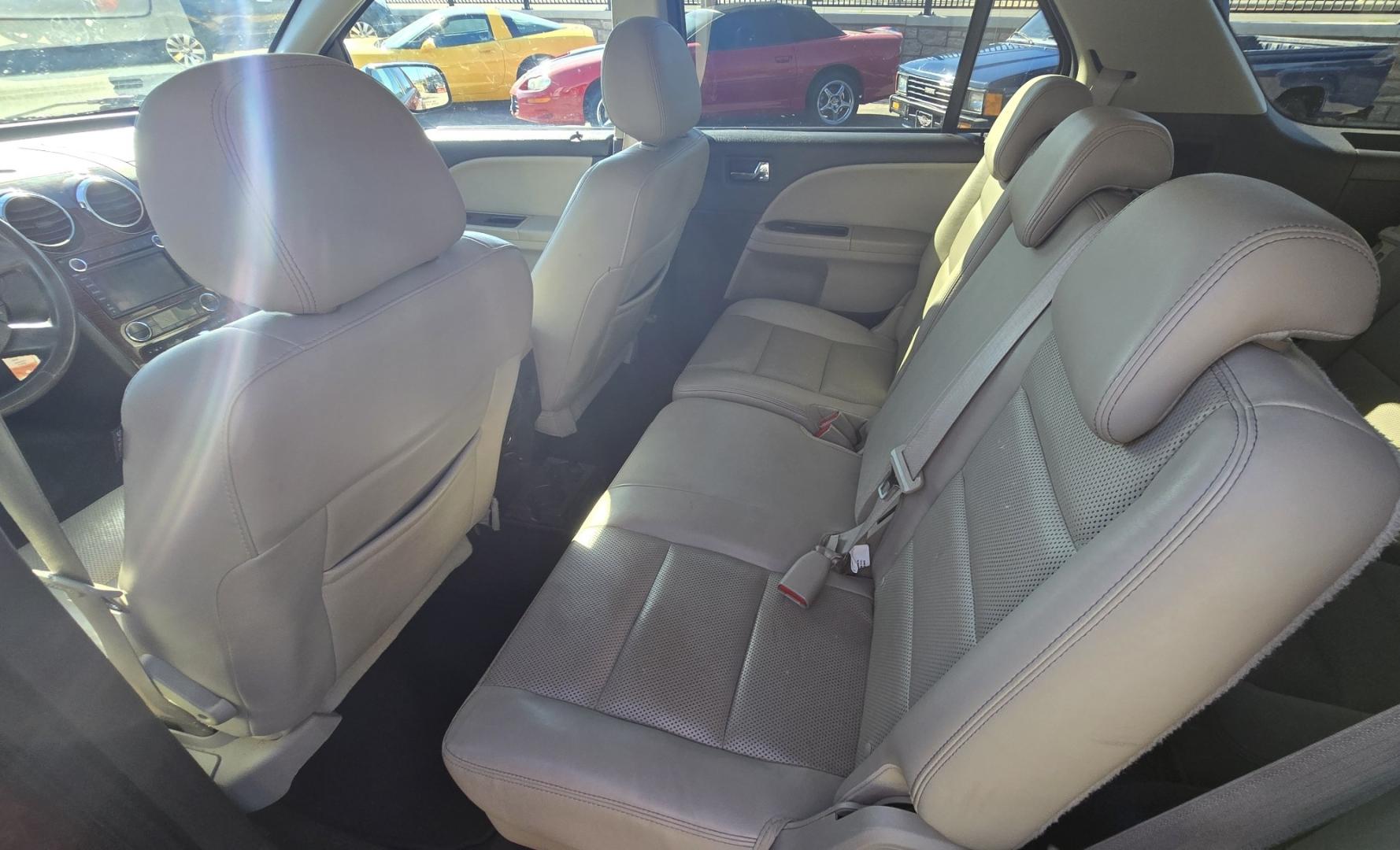 2008 Maroon /Tan Ford Taurus X Limited AWD (1FMDK06W58G) with an 3.5L V6 DOHC 24V engine, 6-Speed Automatic Overdrive transmission, located at 450 N Russell, Missoula, MT, 59801, (406) 543-6600, 46.874496, -114.017433 - AWD SUV High Miles but Runs Amazing. 3.5L V6 Engine. 3rd Row Seating. Rear Entertainment (DVD). Front and Rear Climate Controls. Air. Cruise. Tilt. Bluetooth. AM CM CD Player. Power Heated Front Seats. Hard to Find a AWD with 3rd Row for this Price in such good condition. We Finance through loca - Photo#12
