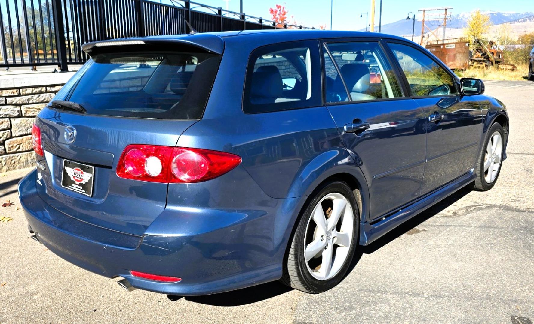 2004 Blue /Tan Mazda MAZDA6 Sport Wagon s (1YVFP82D245) with an 3.0L V6 DOHC 24V engine, 5 Speed Manual transmission, located at 450 N Russell, Missoula, MT, 59801, (406) 543-6600, 46.874496, -114.017433 - Super Clean FWD Wagon. One Owner. Clean Carfax and only 78K Miles. 3.0L V6 Engine. 5 Speed Manual Transmission. Air. Cruise. Tilt. Power Windows and Locks. AM FM CD Player.Power Drivers Seat. Has like New Bridgestone Radials on it and comes with Snow Tires on wheels. Paint is Excellent and Car runs - Photo#2