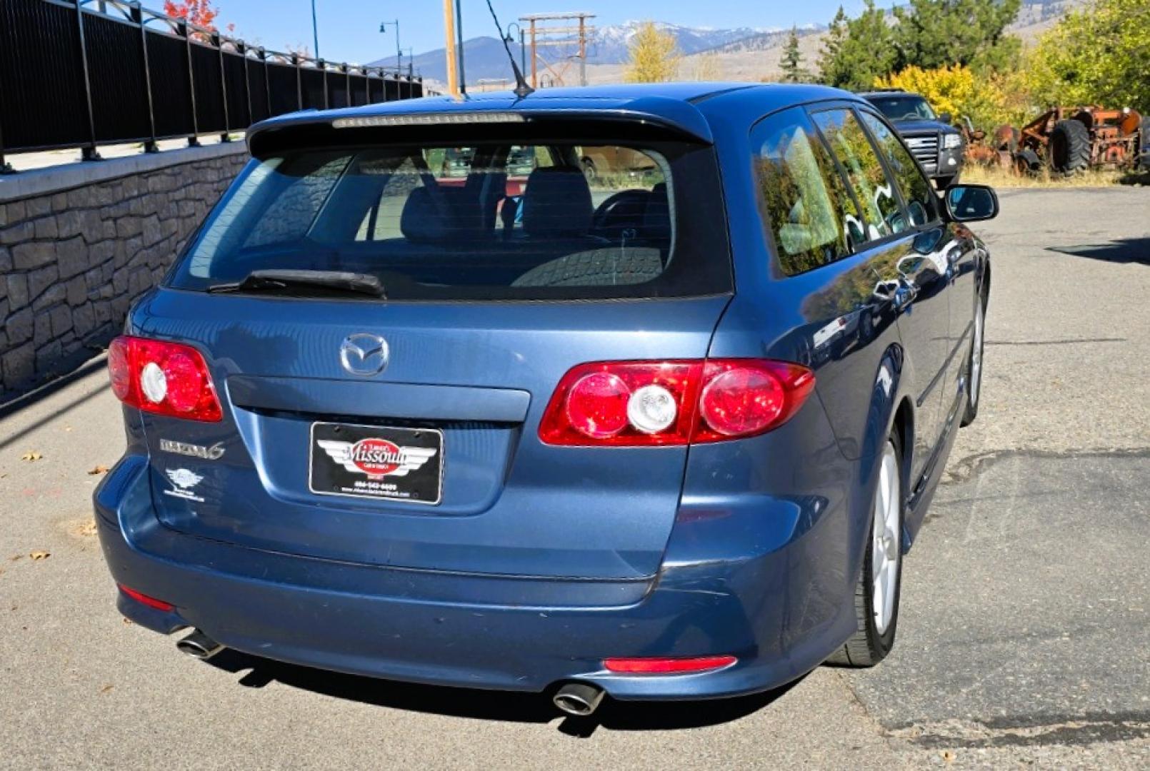 2004 Blue /Tan Mazda MAZDA6 Sport Wagon s (1YVFP82D245) with an 3.0L V6 DOHC 24V engine, 5 Speed Manual transmission, located at 450 N Russell, Missoula, MT, 59801, (406) 543-6600, 46.874496, -114.017433 - Super Clean FWD Wagon. One Owner. Clean Carfax and only 78K Miles. 3.0L V6 Engine. 5 Speed Manual Transmission. Air. Cruise. Tilt. Power Windows and Locks. AM FM CD Player.Power Drivers Seat. Has like New Bridgestone Radials on it and comes with Snow Tires on wheels. Paint is Excellent and Car runs - Photo#3