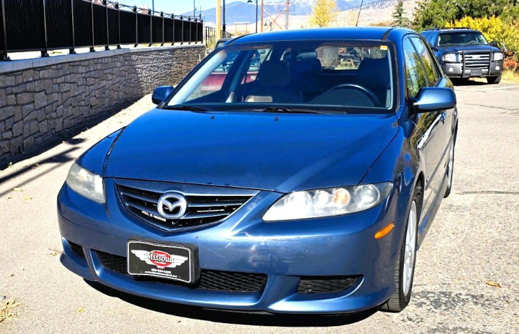 2004 Blue /Tan Mazda MAZDA6 Sport Wagon s (1YVFP82D245) with an 3.0L V6 DOHC 24V engine, 5 Speed Manual transmission, located at 450 N Russell, Missoula, MT, 59801, (406) 543-6600, 46.874496, -114.017433 - Super Clean FWD Wagon. One Owner. Clean Carfax and only 78K Miles. 3.0L V6 Engine. 5 Speed Manual Transmission. Air. Cruise. Tilt. Power Windows and Locks. AM FM CD Player.Power Drivers Seat. Has like New Bridgestone Radials on it and comes with Snow Tires on wheels. Paint is Excellent and Car runs - Photo#7