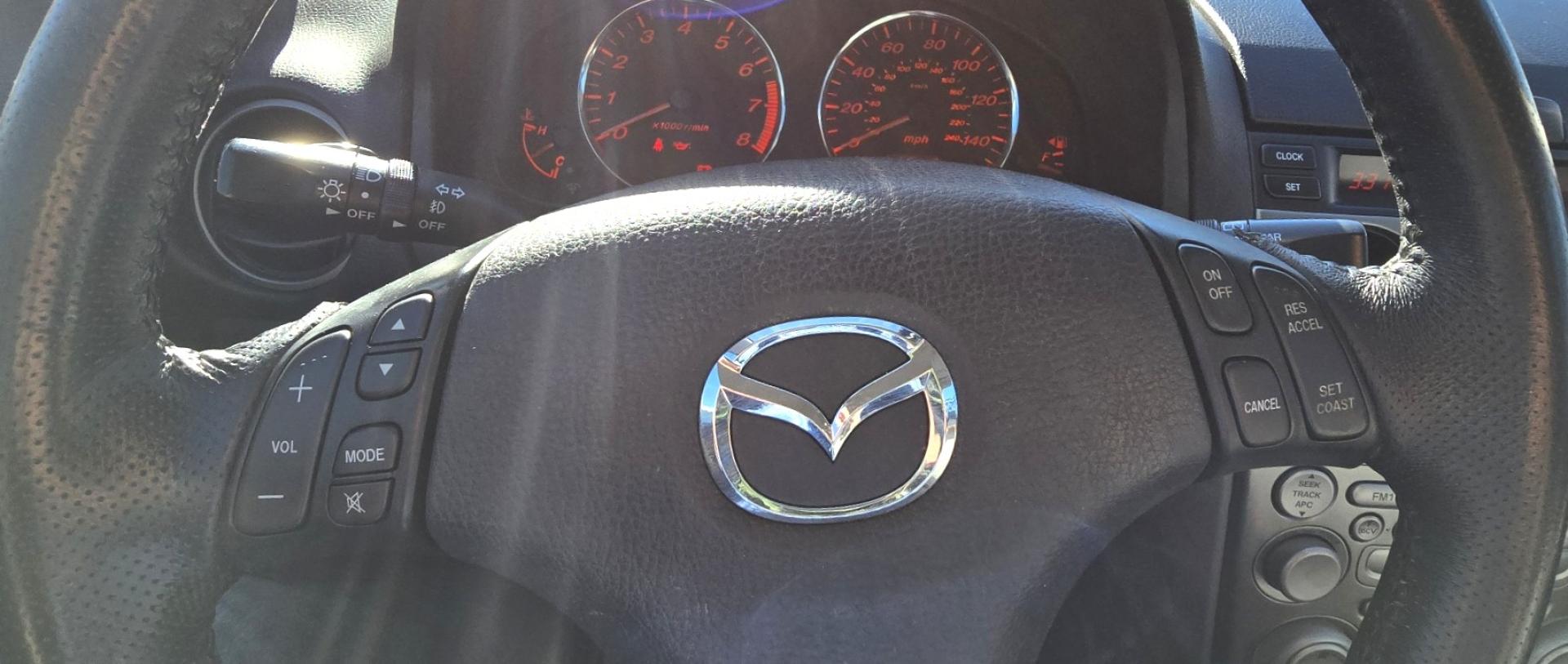 2004 Blue /Tan Mazda MAZDA6 Sport Wagon s (1YVFP82D245) with an 3.0L V6 DOHC 24V engine, 5 Speed Manual transmission, located at 450 N Russell, Missoula, MT, 59801, (406) 543-6600, 46.874496, -114.017433 - Super Clean FWD Wagon. One Owner. Clean Carfax and only 78K Miles. 3.0L V6 Engine. 5 Speed Manual Transmission. Air. Cruise. Tilt. Power Windows and Locks. AM FM CD Player.Power Drivers Seat. Has like New Bridgestone Radials on it and comes with Snow Tires on wheels. Paint is Excellent and Car runs - Photo#14