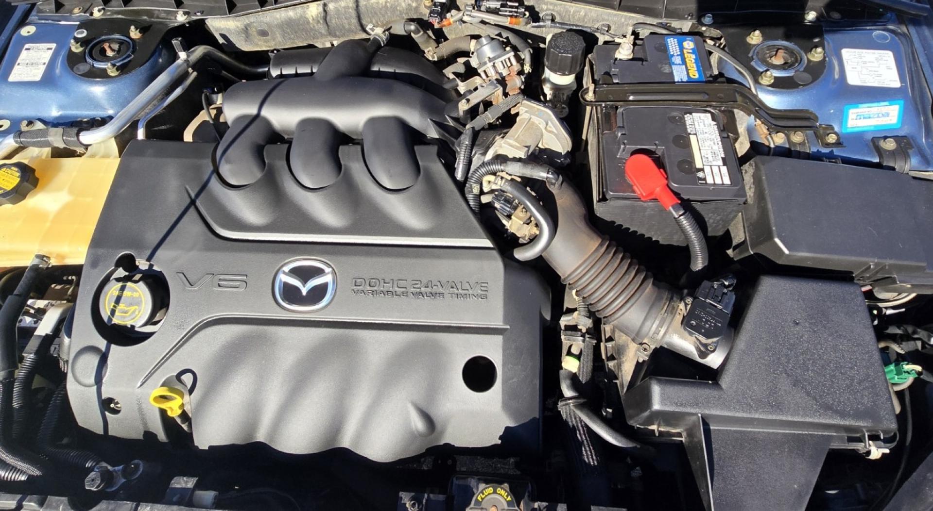 2004 Blue /Tan Mazda MAZDA6 Sport Wagon s (1YVFP82D245) with an 3.0L V6 DOHC 24V engine, 5 Speed Manual transmission, located at 450 N Russell, Missoula, MT, 59801, (406) 543-6600, 46.874496, -114.017433 - Super Clean FWD Wagon. One Owner. Clean Carfax and only 78K Miles. 3.0L V6 Engine. 5 Speed Manual Transmission. Air. Cruise. Tilt. Power Windows and Locks. AM FM CD Player.Power Drivers Seat. Has like New Bridgestone Radials on it and comes with Snow Tires on wheels. Paint is Excellent and Car runs - Photo#16