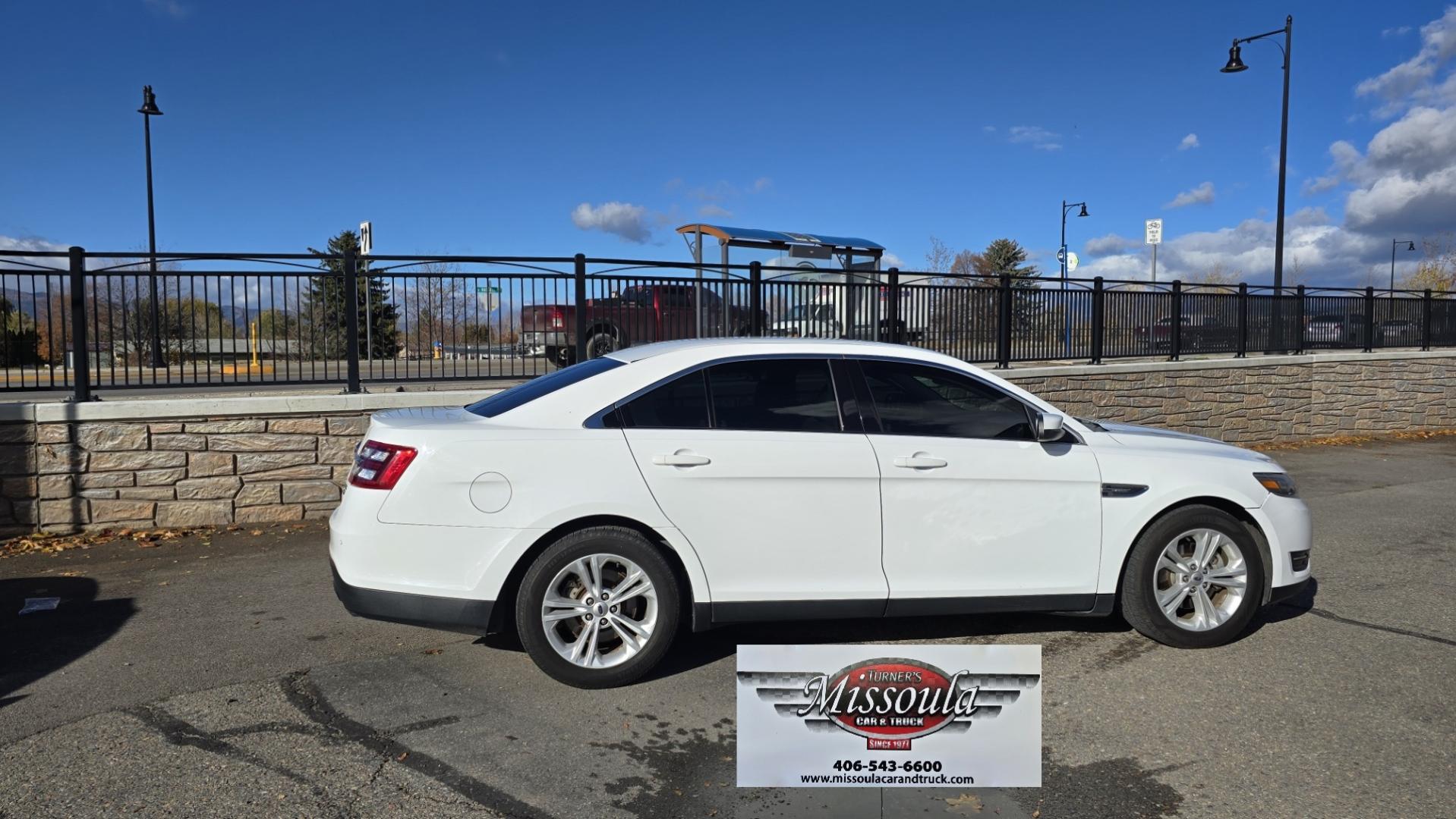 2016 White /Tan Ford Taurus SEL AWD (1FAHP2H83GG) with an 3.5L V6 DOHC 24V engine, 6A transmission, located at 450 N Russell, Missoula, MT, 59801, (406) 543-6600, 46.874496, -114.017433 - Classy Looking AWD Sedan. Peppy 3.5L V6 Engine. 6 Speed Automatic Transmission. Front Power Seats. Air. Cruise. Tilt. AM FM SAT CD. Bluetooth Audio and Phone. Power Windows and Locks. Goodyear Tires. Remote Start. We Finance through local Credit Unions. We do NOT offer In House (Buy Here Pay Her - Photo#4