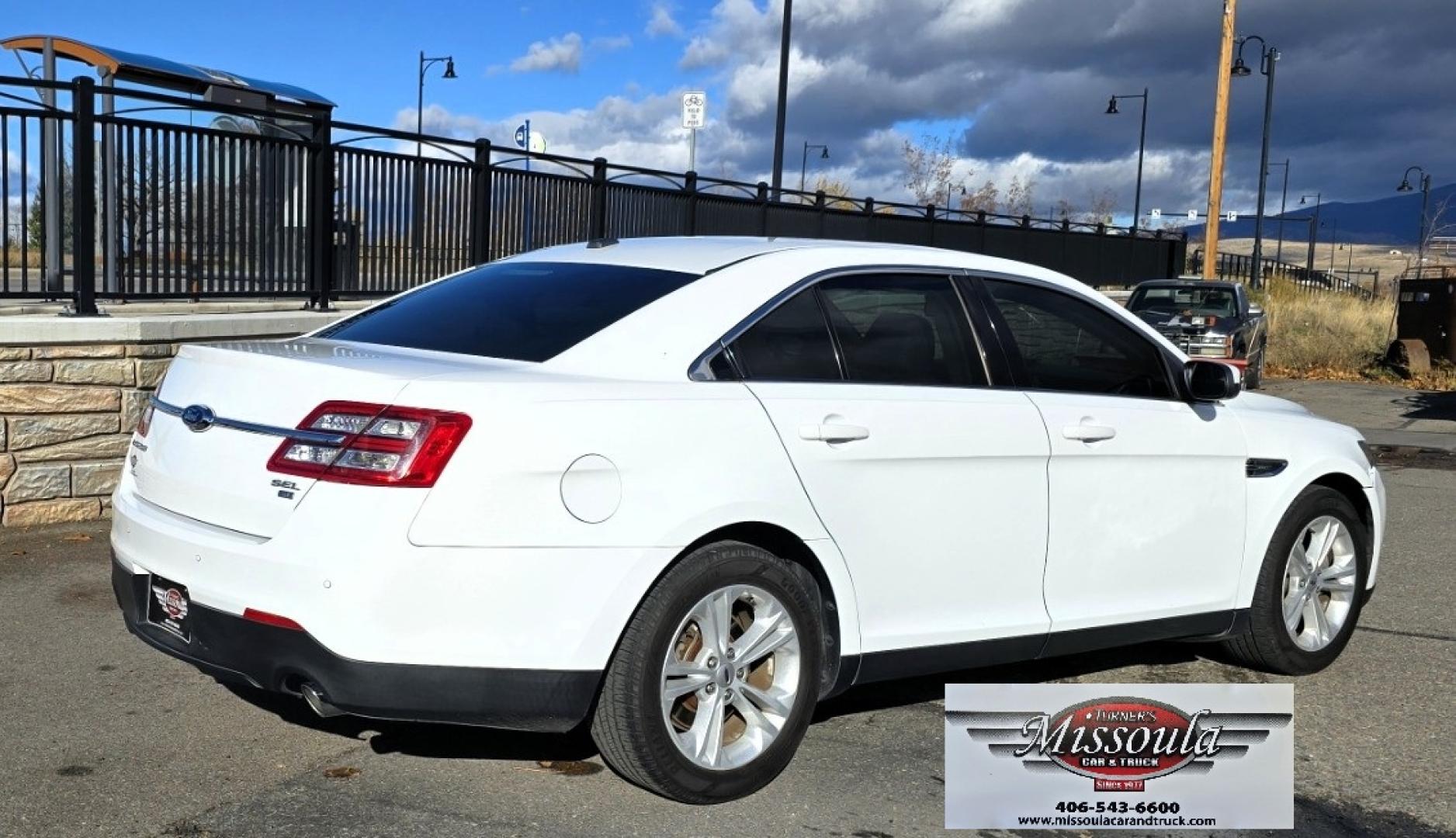 2016 White /Tan Ford Taurus SEL AWD (1FAHP2H83GG) with an 3.5L V6 DOHC 24V engine, 6A transmission, located at 450 N Russell, Missoula, MT, 59801, (406) 543-6600, 46.874496, -114.017433 - Classy Looking AWD Sedan. Peppy 3.5L V6 Engine. 6 Speed Automatic Transmission. Front Power Seats. Air. Cruise. Tilt. AM FM SAT CD. Bluetooth Audio and Phone. Power Windows and Locks. Goodyear Tires. Remote Start. We Finance through local Credit Unions. We do NOT offer In House (Buy Here Pay Her - Photo#5