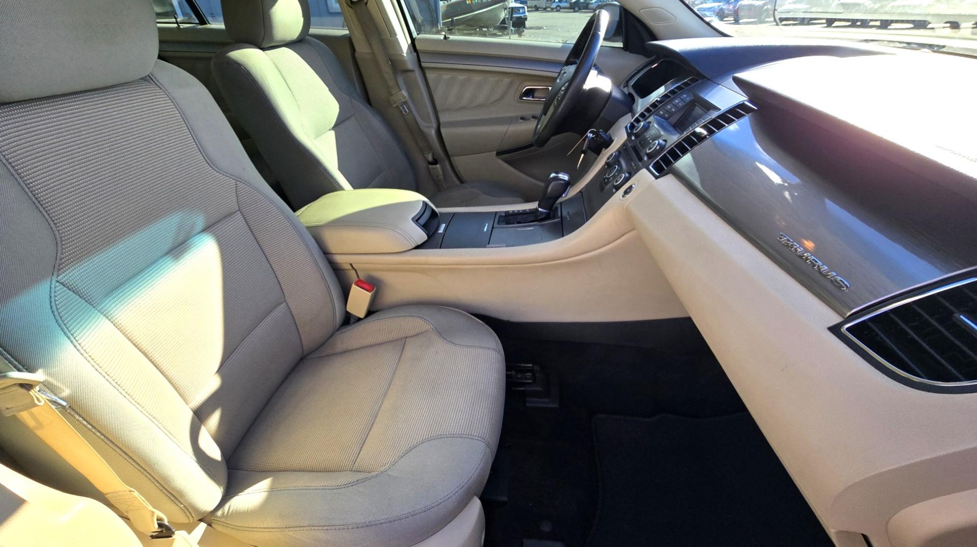 2016 White /Tan Ford Taurus SEL AWD (1FAHP2H83GG) with an 3.5L V6 DOHC 24V engine, 6A transmission, located at 450 N Russell, Missoula, MT, 59801, (406) 543-6600, 46.874496, -114.017433 - Classy Looking AWD Sedan. Peppy 3.5L V6 Engine. 6 Speed Automatic Transmission. Front Power Seats. Air. Cruise. Tilt. AM FM SAT CD. Bluetooth Audio and Phone. Power Windows and Locks. Goodyear Tires. Remote Start. We Finance through local Credit Unions. We do NOT offer In House (Buy Here Pay Her - Photo#12