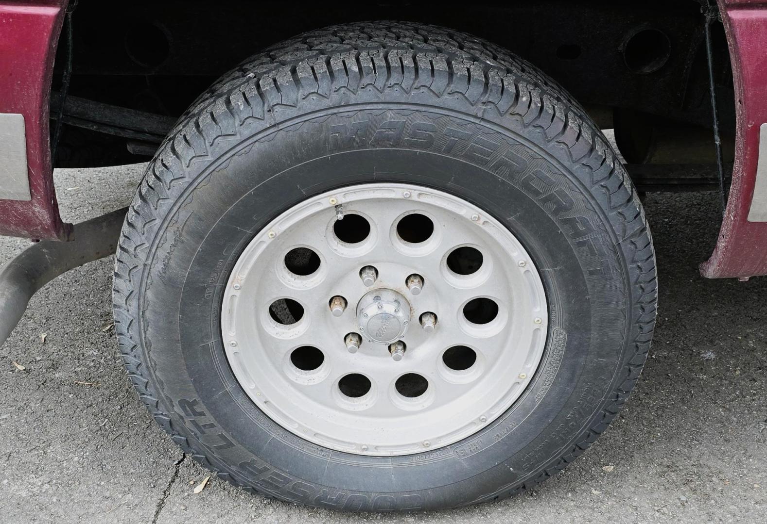 2004 Maroon /Gray Chevrolet Silverado 1500 LS Crew Cab 4WD (2GCEK13T641) with an 5.3L V8 OHV 16V engine, 4-Speed Automatic Overdrive transmission, located at 450 N Russell, Missoula, MT, 59801, (406) 543-6600, 46.874496, -114.017433 - Great Running 4WD Silverado. 4WD Automatic Transmission. 5.3L V8 Engine. Very Comfortable Seats. Air. Cruise. Tilt. Power Windows and Locks. AM FM CD Player. The vehicle was stolen from a previous owner in 2016. The Insurance paid off a total loss before the vehicle was recovered. Once it was recov - Photo#17