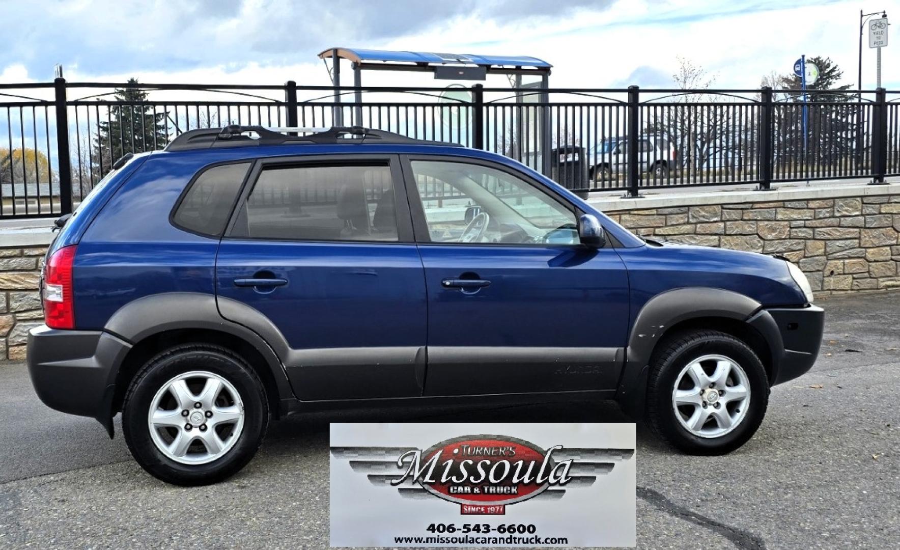 2005 Blue /White Hyundai Tucson GLS 2.7 4WD (KM8JN72D65U) with an 2.6L V6 DOHC 24V engine, 4-Speed Automatic Overdrive transmission, located at 450 N Russell, Missoula, MT, 59801, (406) 543-6600, 46.874496, -114.017433 - Hard to come across Affordable 2 Owner AWD SUV. Spunky 2.7L V6 Engine. Automatic Transmission. Power Sunroof. Power Windows and Locks. Heated Seats. Air. Cruise. Tilt. AM FM Cassette. Excellent Tires. Passenger Front Seat is a little worn so it has a seat cover on it. Because of the age, financi - Photo#0