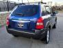 2005 Blue /White Hyundai Tucson GLS 2.7 4WD (KM8JN72D65U) with an 2.6L V6 DOHC 24V engine, 4-Speed Automatic Overdrive transmission, located at 450 N Russell, Missoula, MT, 59801, (406) 543-6600, 46.874496, -114.017433 - Hard to come across Affordable 2 Owner AWD SUV. Spunky 2.7L V6 Engine. Automatic Transmission. Power Sunroof. Power Windows and Locks. Heated Seats. Air. Cruise. Tilt. AM FM Cassette. Excellent Tires. Passenger Front Seat is a little worn so it has a seat cover on it. Because of the age, financi - Photo#2