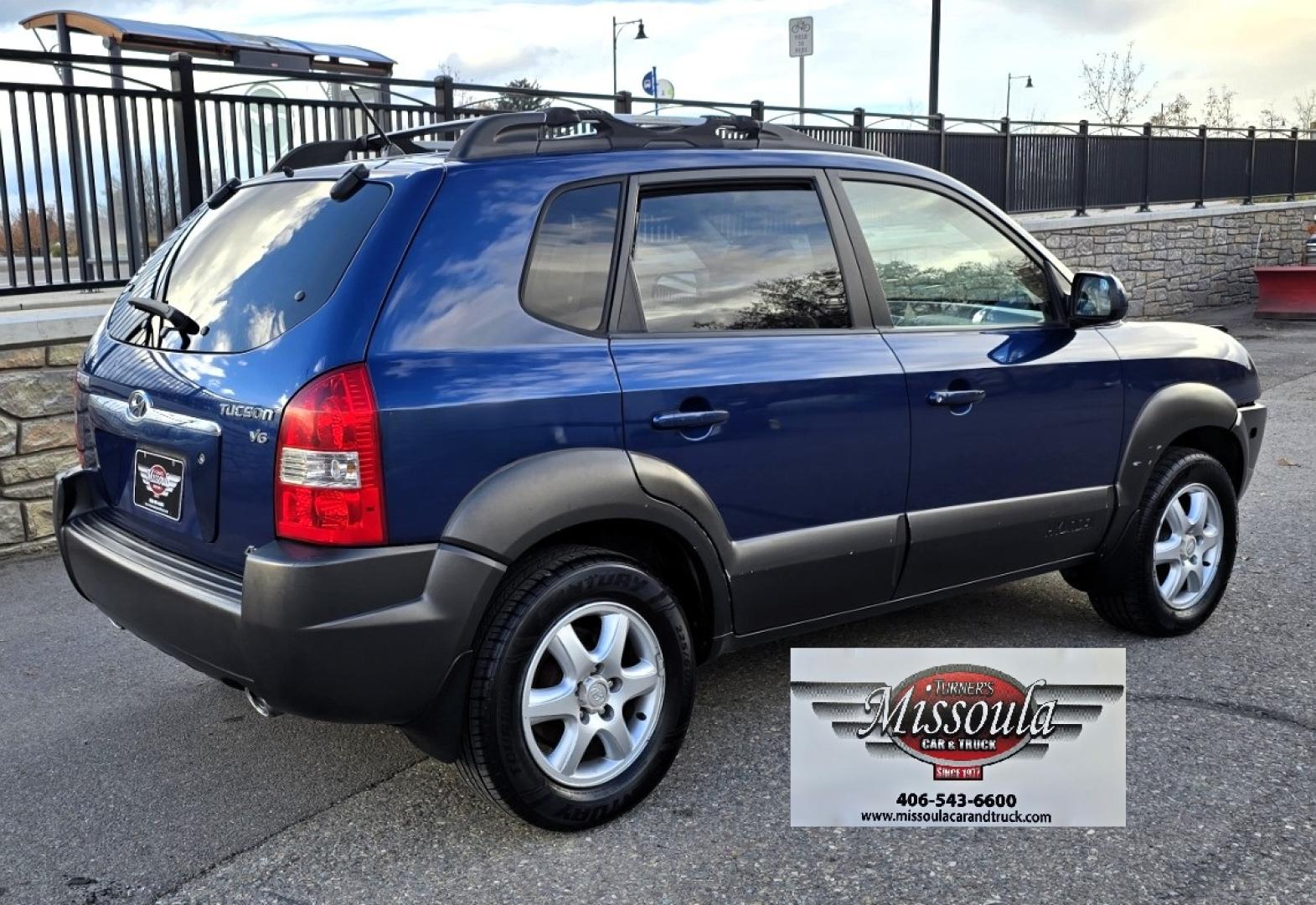 2005 Blue /White Hyundai Tucson GLS 2.7 4WD (KM8JN72D65U) with an 2.6L V6 DOHC 24V engine, 4-Speed Automatic Overdrive transmission, located at 450 N Russell, Missoula, MT, 59801, (406) 543-6600, 46.874496, -114.017433 - Hard to come across Affordable 2 Owner AWD SUV. Spunky 2.7L V6 Engine. Automatic Transmission. Power Sunroof. Power Windows and Locks. Heated Seats. Air. Cruise. Tilt. AM FM Cassette. Excellent Tires. Passenger Front Seat is a little worn so it has a seat cover on it. Because of the age, financi - Photo#1