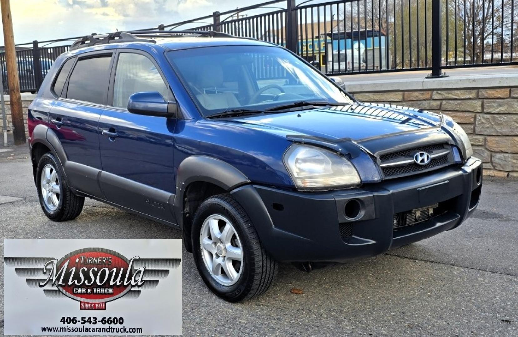 2005 Blue /White Hyundai Tucson GLS 2.7 4WD (KM8JN72D65U) with an 2.6L V6 DOHC 24V engine, 4-Speed Automatic Overdrive transmission, located at 450 N Russell, Missoula, MT, 59801, (406) 543-6600, 46.874496, -114.017433 - Hard to come across Affordable 2 Owner AWD SUV. Spunky 2.7L V6 Engine. Automatic Transmission. Power Sunroof. Power Windows and Locks. Heated Seats. Air. Cruise. Tilt. AM FM Cassette. Excellent Tires. Passenger Front Seat is a little worn so it has a seat cover on it. Because of the age, financi - Photo#3