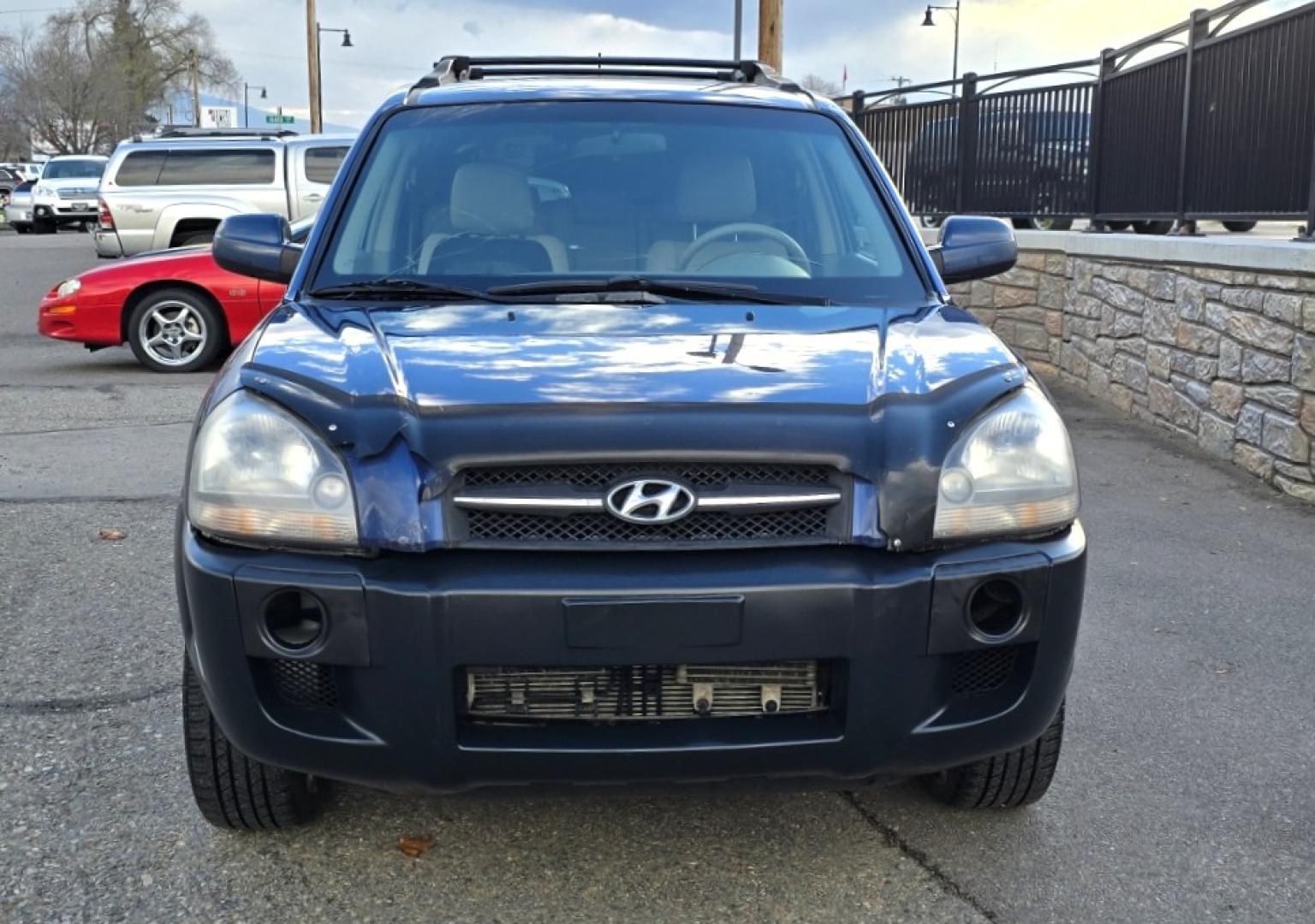 2005 Blue /White Hyundai Tucson GLS 2.7 4WD (KM8JN72D65U) with an 2.6L V6 DOHC 24V engine, 4-Speed Automatic Overdrive transmission, located at 450 N Russell, Missoula, MT, 59801, (406) 543-6600, 46.874496, -114.017433 - Hard to come across Affordable 2 Owner AWD SUV. Spunky 2.7L V6 Engine. Automatic Transmission. Power Sunroof. Power Windows and Locks. Heated Seats. Air. Cruise. Tilt. AM FM Cassette. Excellent Tires. Passenger Front Seat is a little worn so it has a seat cover on it. Because of the age, financi - Photo#4