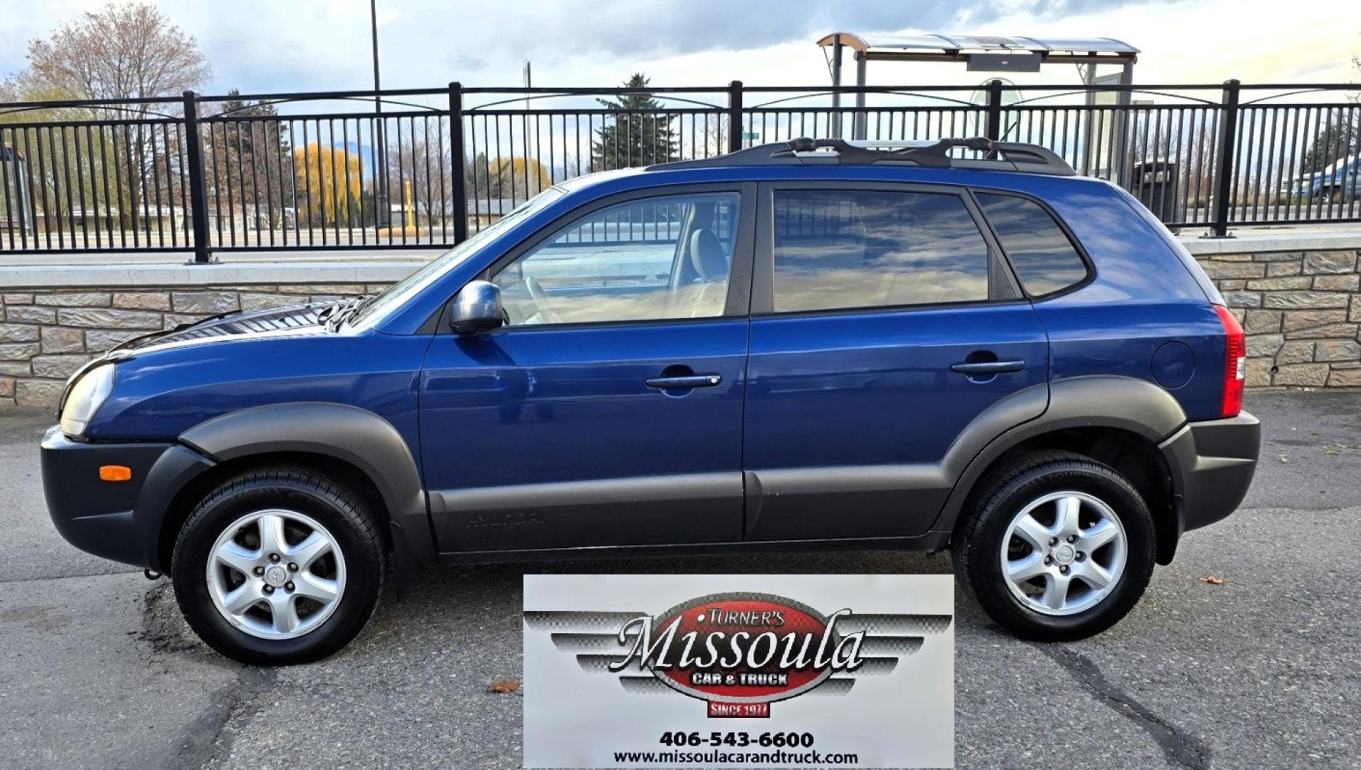 2005 Blue /White Hyundai Tucson GLS 2.7 4WD (KM8JN72D65U) with an 2.6L V6 DOHC 24V engine, 4-Speed Automatic Overdrive transmission, located at 450 N Russell, Missoula, MT, 59801, (406) 543-6600, 46.874496, -114.017433 - Hard to come across Affordable 2 Owner AWD SUV. Spunky 2.7L V6 Engine. Automatic Transmission. Power Sunroof. Power Windows and Locks. Heated Seats. Air. Cruise. Tilt. AM FM Cassette. Excellent Tires. Passenger Front Seat is a little worn so it has a seat cover on it. Because of the age, financi - Photo#5