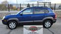 2005 Blue /White Hyundai Tucson GLS 2.7 4WD (KM8JN72D65U) with an 2.6L V6 DOHC 24V engine, 4-Speed Automatic Overdrive transmission, located at 450 N Russell, Missoula, MT, 59801, (406) 543-6600, 46.874496, -114.017433 - Hard to come across Affordable 2 Owner AWD SUV. Spunky 2.7L V6 Engine. Automatic Transmission. Power Sunroof. Power Windows and Locks. Heated Seats. Air. Cruise. Tilt. AM FM Cassette. Excellent Tires. Passenger Front Seat is a little worn so it has a seat cover on it. Because of the age, financi - Photo#5