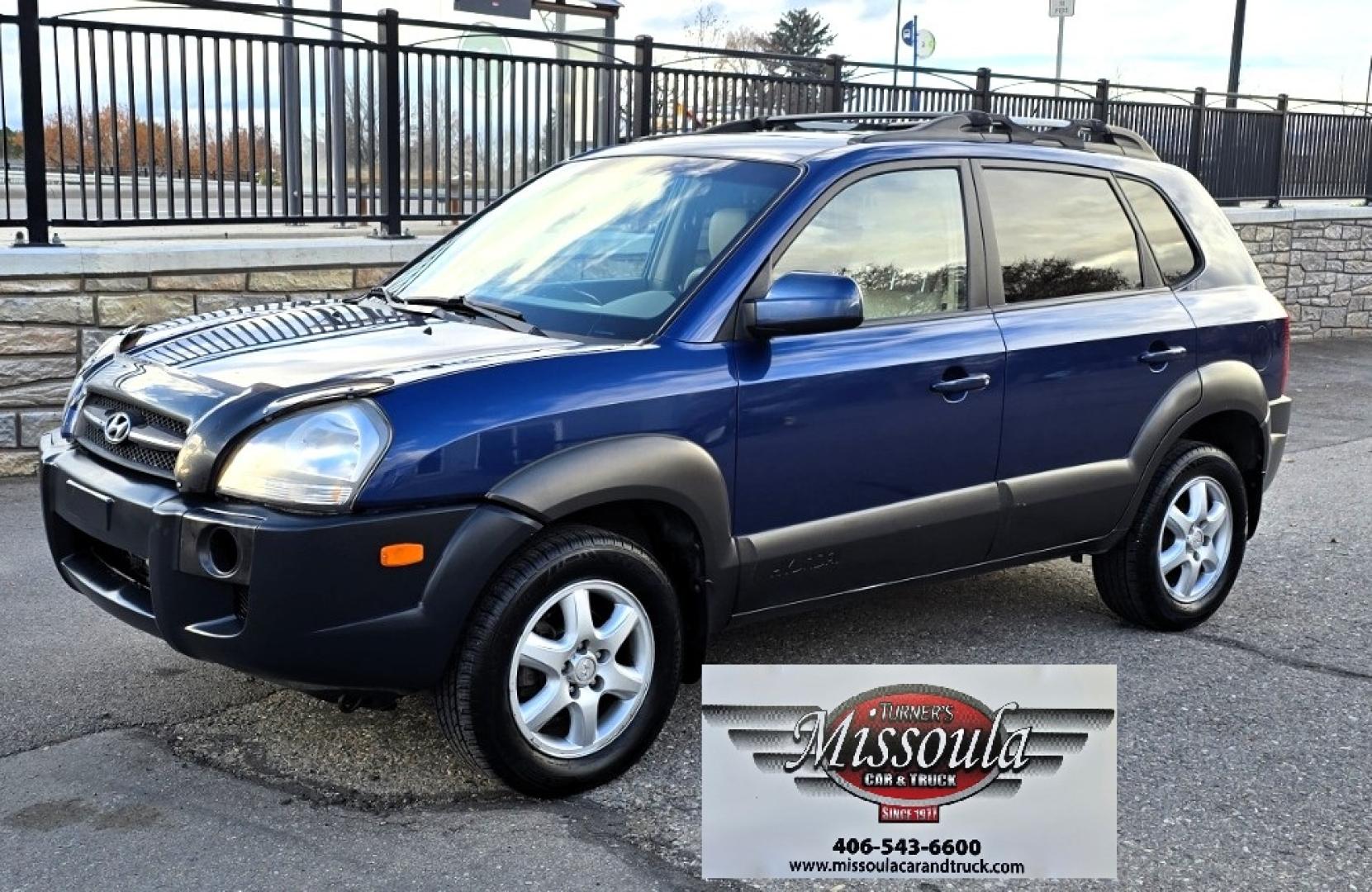 2005 Blue /White Hyundai Tucson GLS 2.7 4WD (KM8JN72D65U) with an 2.6L V6 DOHC 24V engine, 4-Speed Automatic Overdrive transmission, located at 450 N Russell, Missoula, MT, 59801, (406) 543-6600, 46.874496, -114.017433 - Hard to come across Affordable 2 Owner AWD SUV. Spunky 2.7L V6 Engine. Automatic Transmission. Power Sunroof. Power Windows and Locks. Heated Seats. Air. Cruise. Tilt. AM FM Cassette. Excellent Tires. Passenger Front Seat is a little worn so it has a seat cover on it. Because of the age, financi - Photo#6
