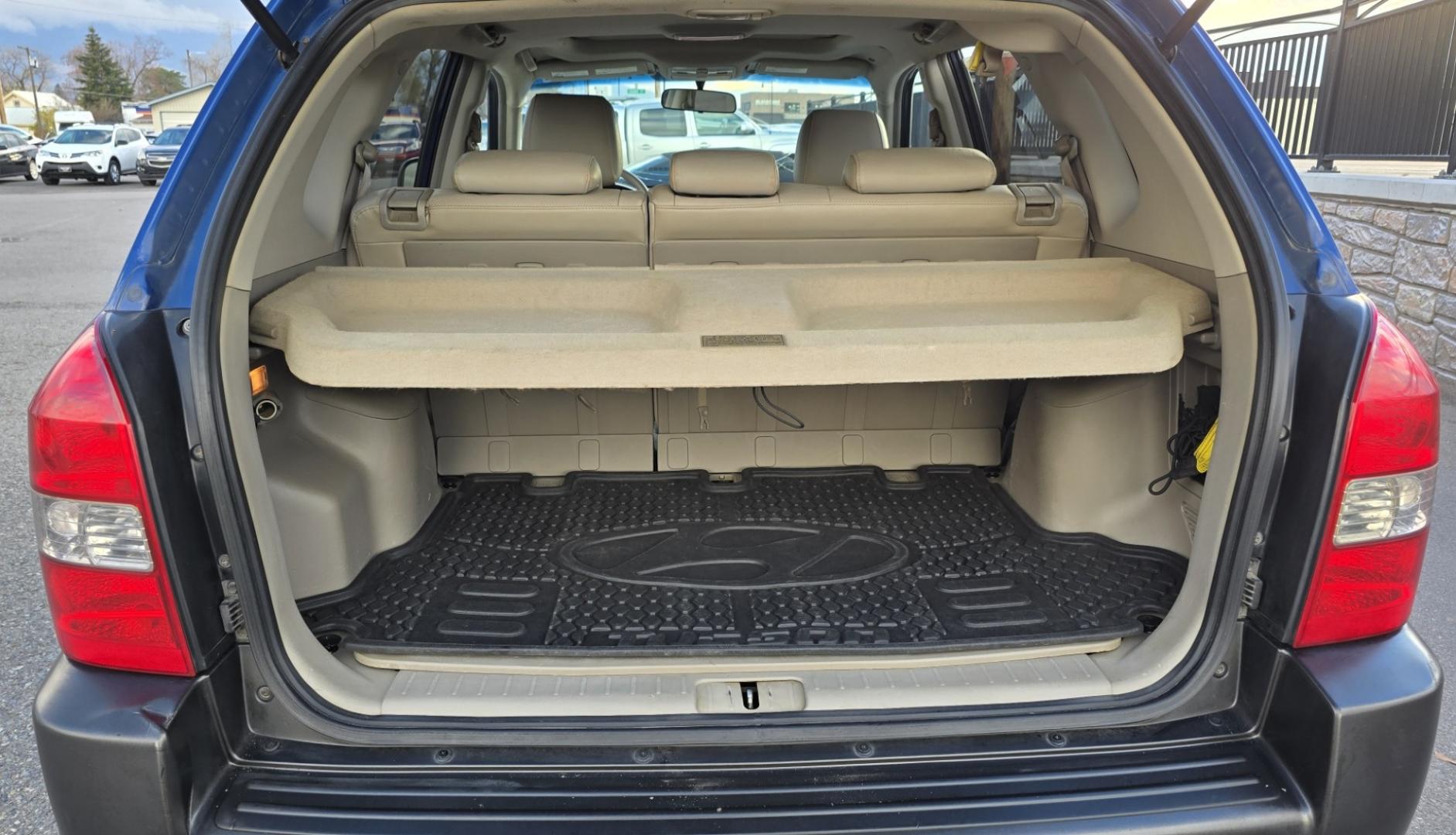 2005 Blue /White Hyundai Tucson GLS 2.7 4WD (KM8JN72D65U) with an 2.6L V6 DOHC 24V engine, 4-Speed Automatic Overdrive transmission, located at 450 N Russell, Missoula, MT, 59801, (406) 543-6600, 46.874496, -114.017433 - Hard to come across Affordable 2 Owner AWD SUV. Spunky 2.7L V6 Engine. Automatic Transmission. Power Sunroof. Power Windows and Locks. Heated Seats. Air. Cruise. Tilt. AM FM Cassette. Excellent Tires. Passenger Front Seat is a little worn so it has a seat cover on it. Because of the age, financi - Photo#8