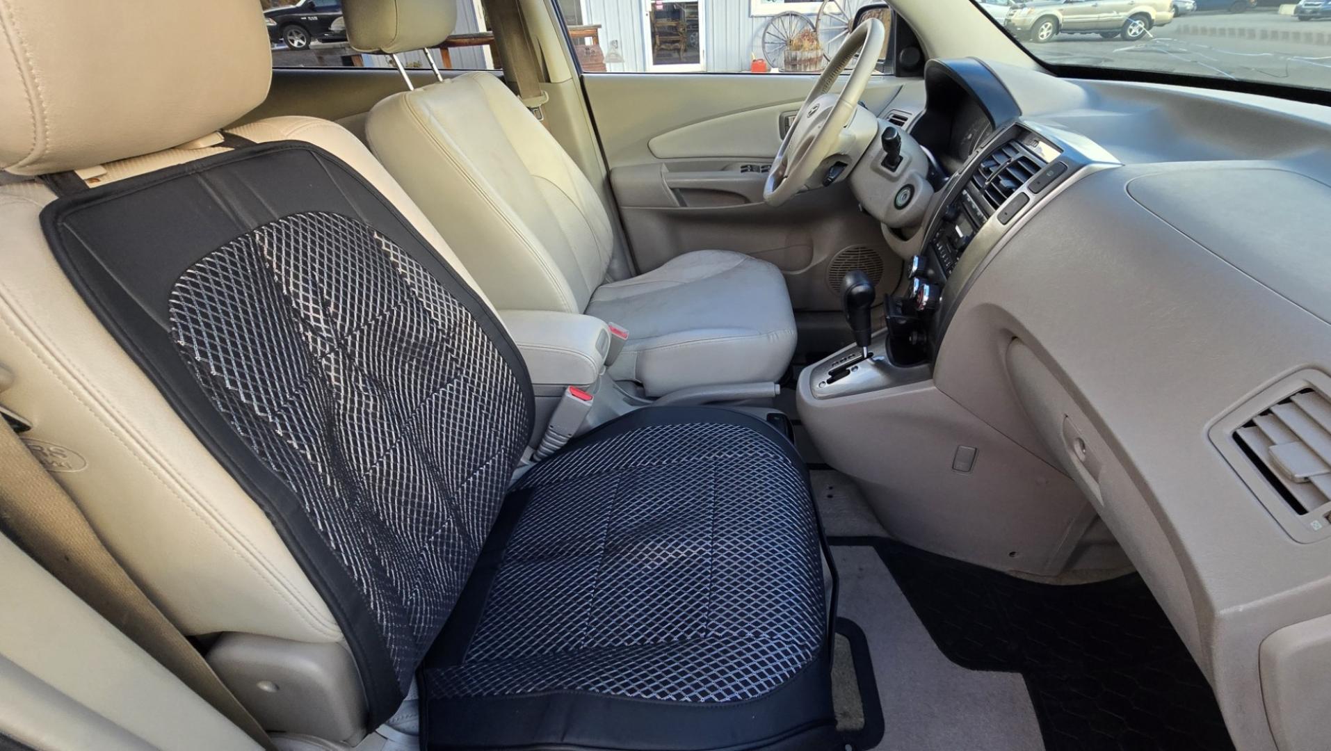 2005 Blue /White Hyundai Tucson GLS 2.7 4WD (KM8JN72D65U) with an 2.6L V6 DOHC 24V engine, 4-Speed Automatic Overdrive transmission, located at 450 N Russell, Missoula, MT, 59801, (406) 543-6600, 46.874496, -114.017433 - Hard to come across Affordable 2 Owner AWD SUV. Spunky 2.7L V6 Engine. Automatic Transmission. Power Sunroof. Power Windows and Locks. Heated Seats. Air. Cruise. Tilt. AM FM Cassette. Excellent Tires. Passenger Front Seat is a little worn so it has a seat cover on it. Because of the age, financi - Photo#11