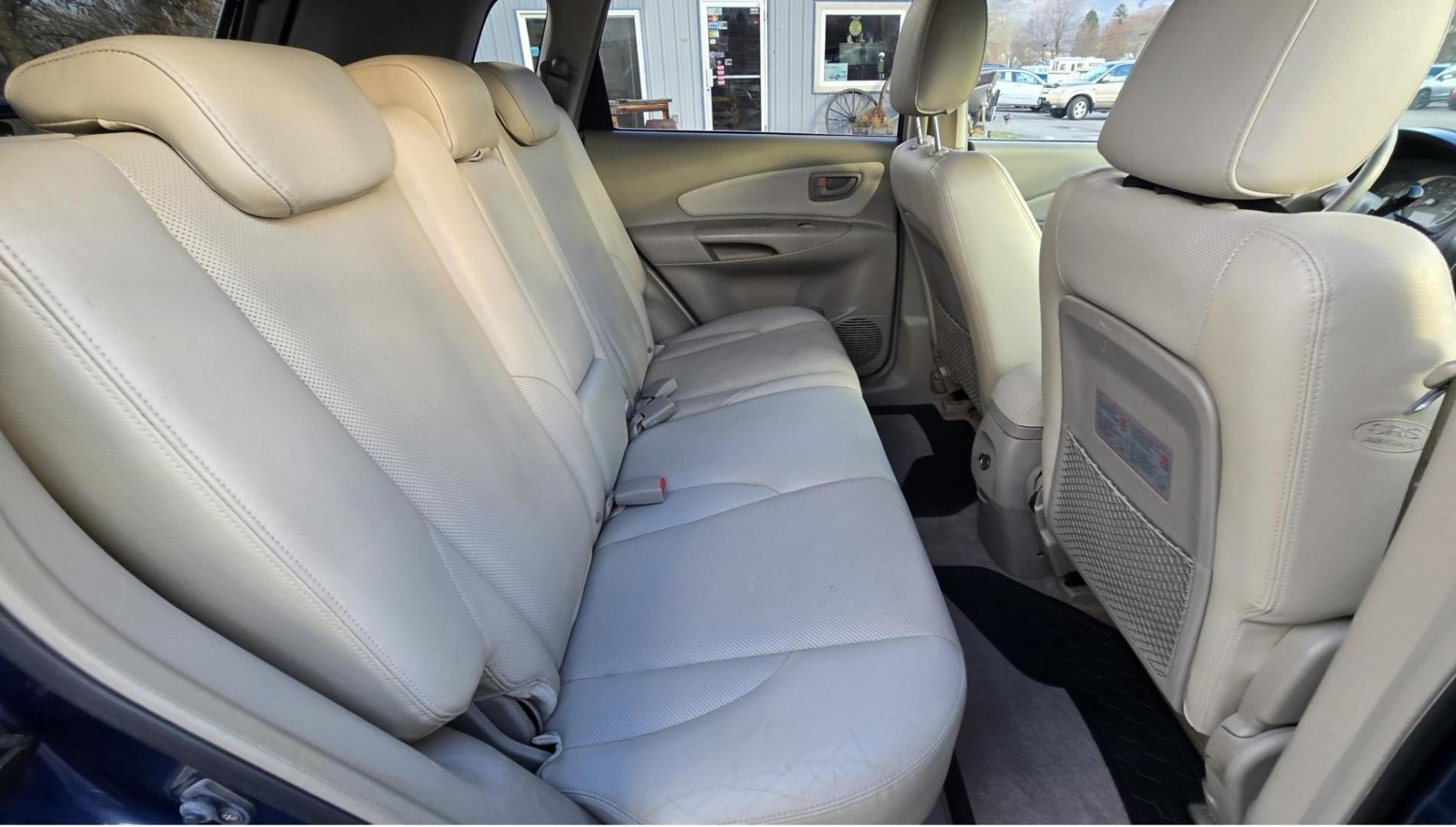 2005 Blue /White Hyundai Tucson GLS 2.7 4WD (KM8JN72D65U) with an 2.6L V6 DOHC 24V engine, 4-Speed Automatic Overdrive transmission, located at 450 N Russell, Missoula, MT, 59801, (406) 543-6600, 46.874496, -114.017433 - Hard to come across Affordable 2 Owner AWD SUV. Spunky 2.7L V6 Engine. Automatic Transmission. Power Sunroof. Power Windows and Locks. Heated Seats. Air. Cruise. Tilt. AM FM Cassette. Excellent Tires. Passenger Front Seat is a little worn so it has a seat cover on it. Because of the age, financi - Photo#10