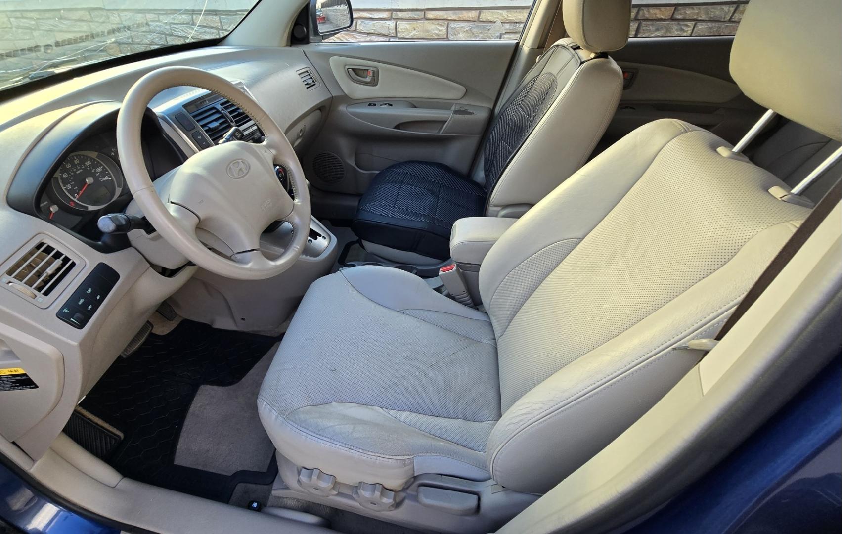 2005 Blue /White Hyundai Tucson GLS 2.7 4WD (KM8JN72D65U) with an 2.6L V6 DOHC 24V engine, 4-Speed Automatic Overdrive transmission, located at 450 N Russell, Missoula, MT, 59801, (406) 543-6600, 46.874496, -114.017433 - Hard to come across Affordable 2 Owner AWD SUV. Spunky 2.7L V6 Engine. Automatic Transmission. Power Sunroof. Power Windows and Locks. Heated Seats. Air. Cruise. Tilt. AM FM Cassette. Excellent Tires. Passenger Front Seat is a little worn so it has a seat cover on it. Because of the age, financi - Photo#14