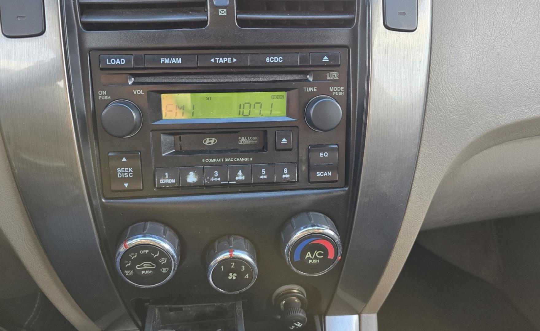 2005 Blue /White Hyundai Tucson GLS 2.7 4WD (KM8JN72D65U) with an 2.6L V6 DOHC 24V engine, 4-Speed Automatic Overdrive transmission, located at 450 N Russell, Missoula, MT, 59801, (406) 543-6600, 46.874496, -114.017433 - Hard to come across Affordable 2 Owner AWD SUV. Spunky 2.7L V6 Engine. Automatic Transmission. Power Sunroof. Power Windows and Locks. Heated Seats. Air. Cruise. Tilt. AM FM Cassette. Excellent Tires. Passenger Front Seat is a little worn so it has a seat cover on it. Because of the age, financi - Photo#16