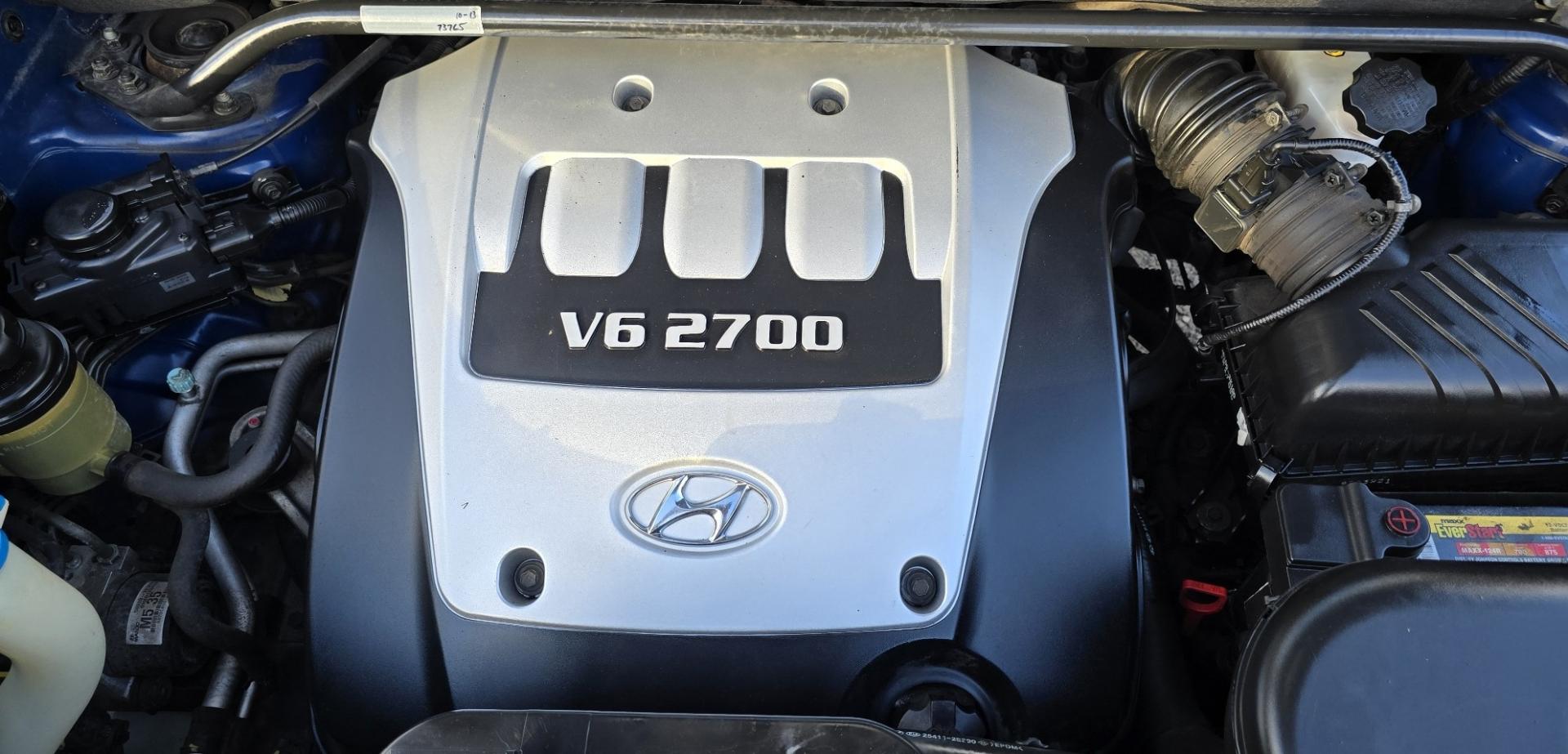 2005 Blue /White Hyundai Tucson GLS 2.7 4WD (KM8JN72D65U) with an 2.6L V6 DOHC 24V engine, 4-Speed Automatic Overdrive transmission, located at 450 N Russell, Missoula, MT, 59801, (406) 543-6600, 46.874496, -114.017433 - Hard to come across Affordable 2 Owner AWD SUV. Spunky 2.7L V6 Engine. Automatic Transmission. Power Sunroof. Power Windows and Locks. Heated Seats. Air. Cruise. Tilt. AM FM Cassette. Excellent Tires. Passenger Front Seat is a little worn so it has a seat cover on it. Because of the age, financi - Photo#20